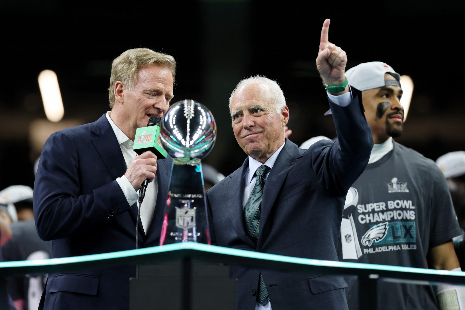 NFL commissioner Roger Goodell presents Philadelphia Eagles general manager Howie Roseman the Vince Lombardi Trophy after winning against Kansas City Chiefs in Super Bowl LIX at Caesars Superdome.