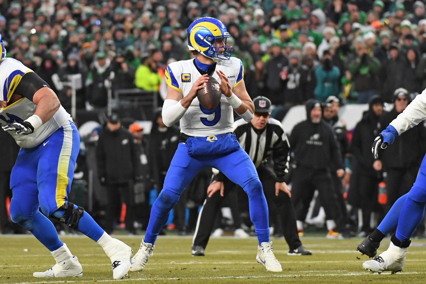 Los Angeles Rams quarterback Matthew Stafford (9) looks for a receiver against the Philadelphia Eagles in a 2025 NFC divisional round game at Lincoln Financial Field.