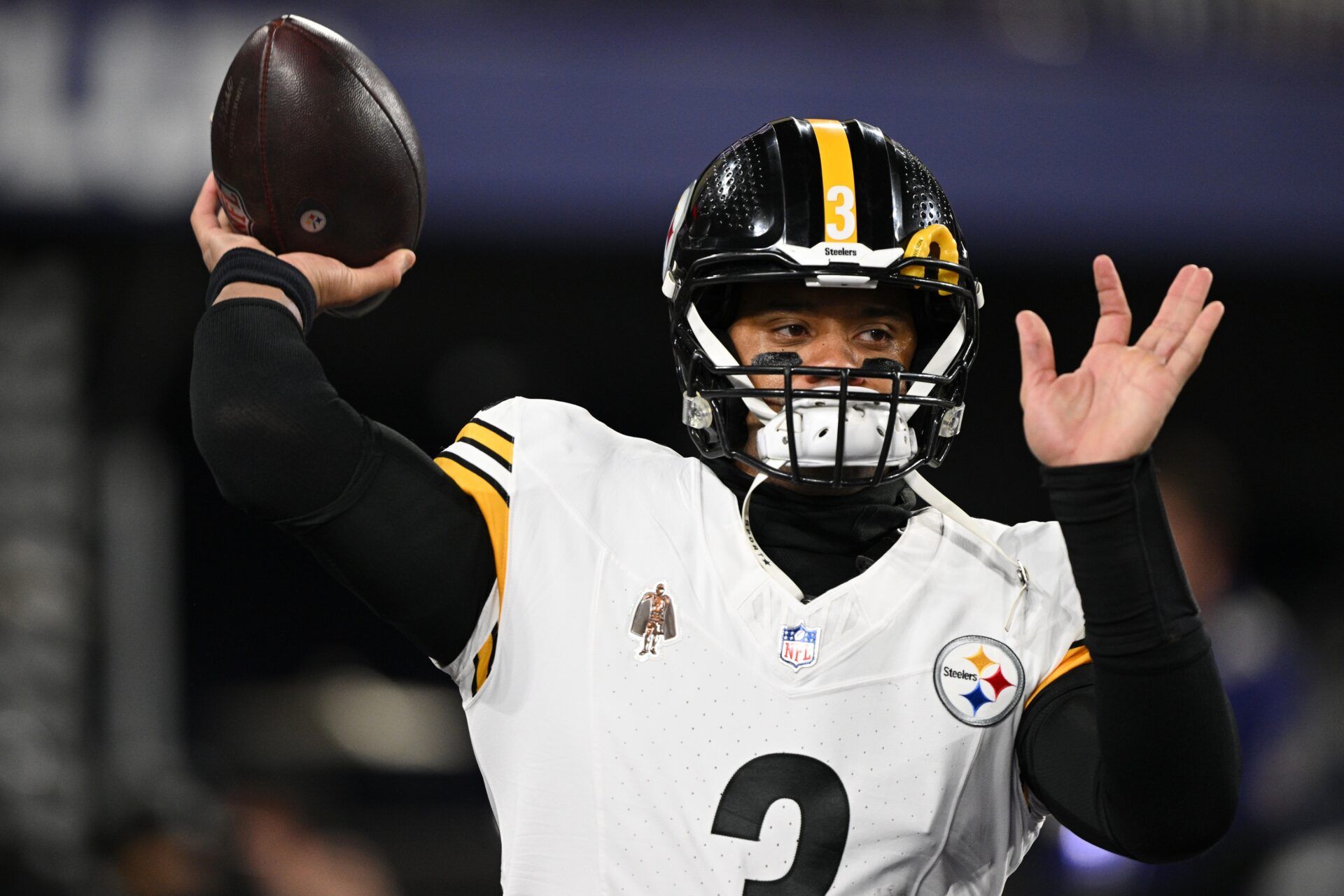 Pittsburgh Steelers quarterback Russell Wilson (3) warms up before an AFC wild card game against the Baltimore Ravens at M&T Bank Stadium.