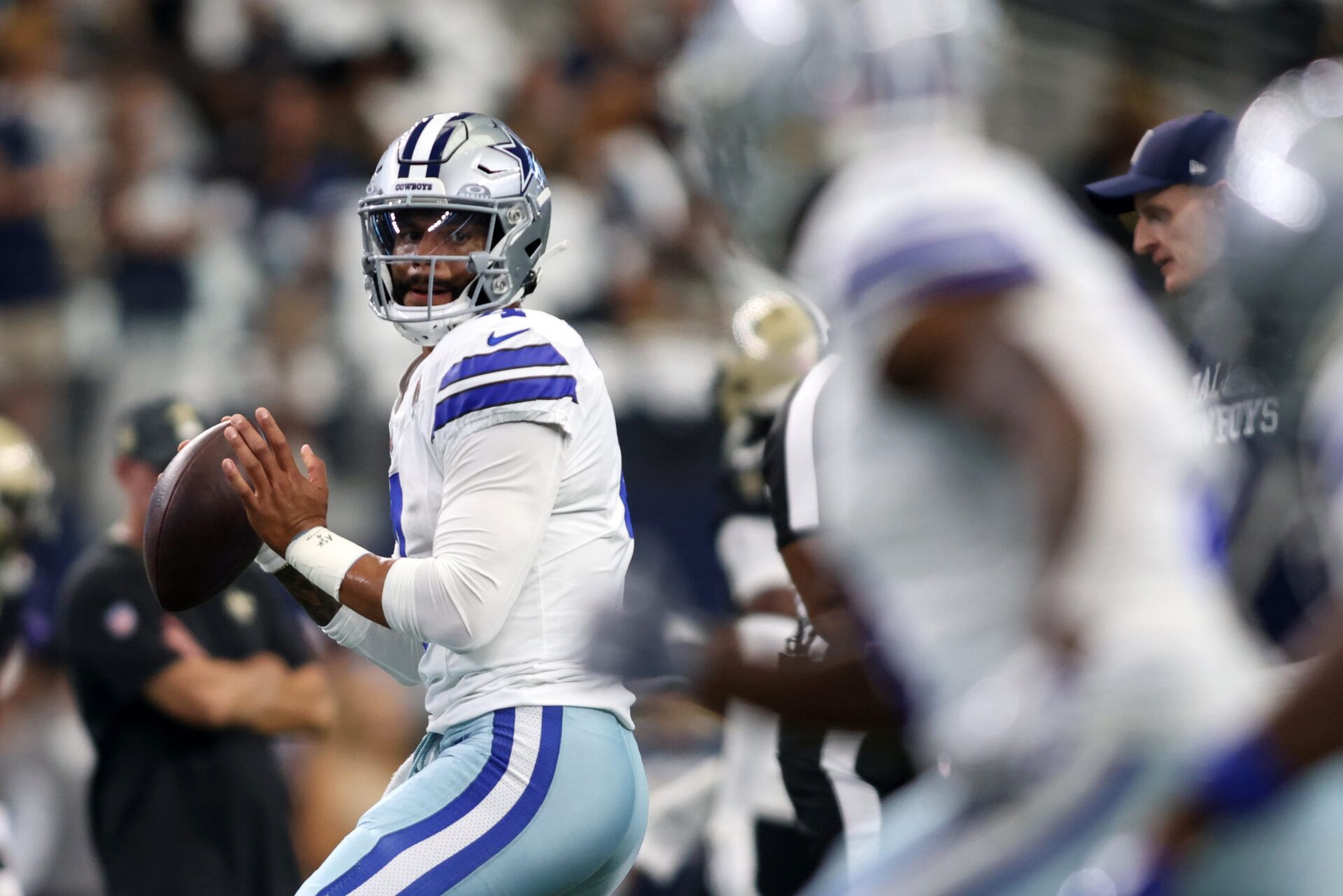Sep 15, 2024; Arlington, Texas, USA; Dallas Cowboys quarterback Dak Prescott (4) warms up before a game against the New Orleans Saints at AT&T Stadium. Mandatory Credit: Tim Heitman-Imagn Images