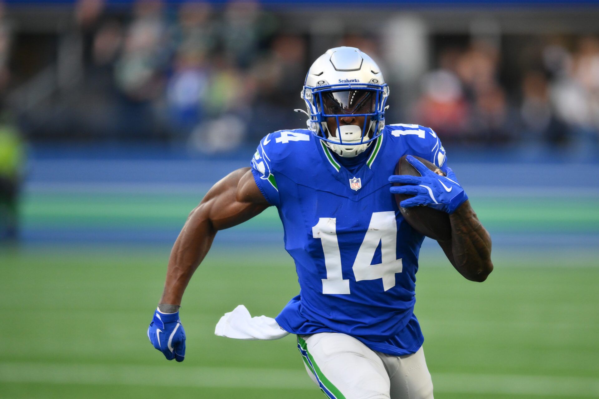 Seattle Seahawks wide receiver DK Metcalf (14) carries the ball after a catch during the first half against the San Francisco 49ers at Lumen Field.