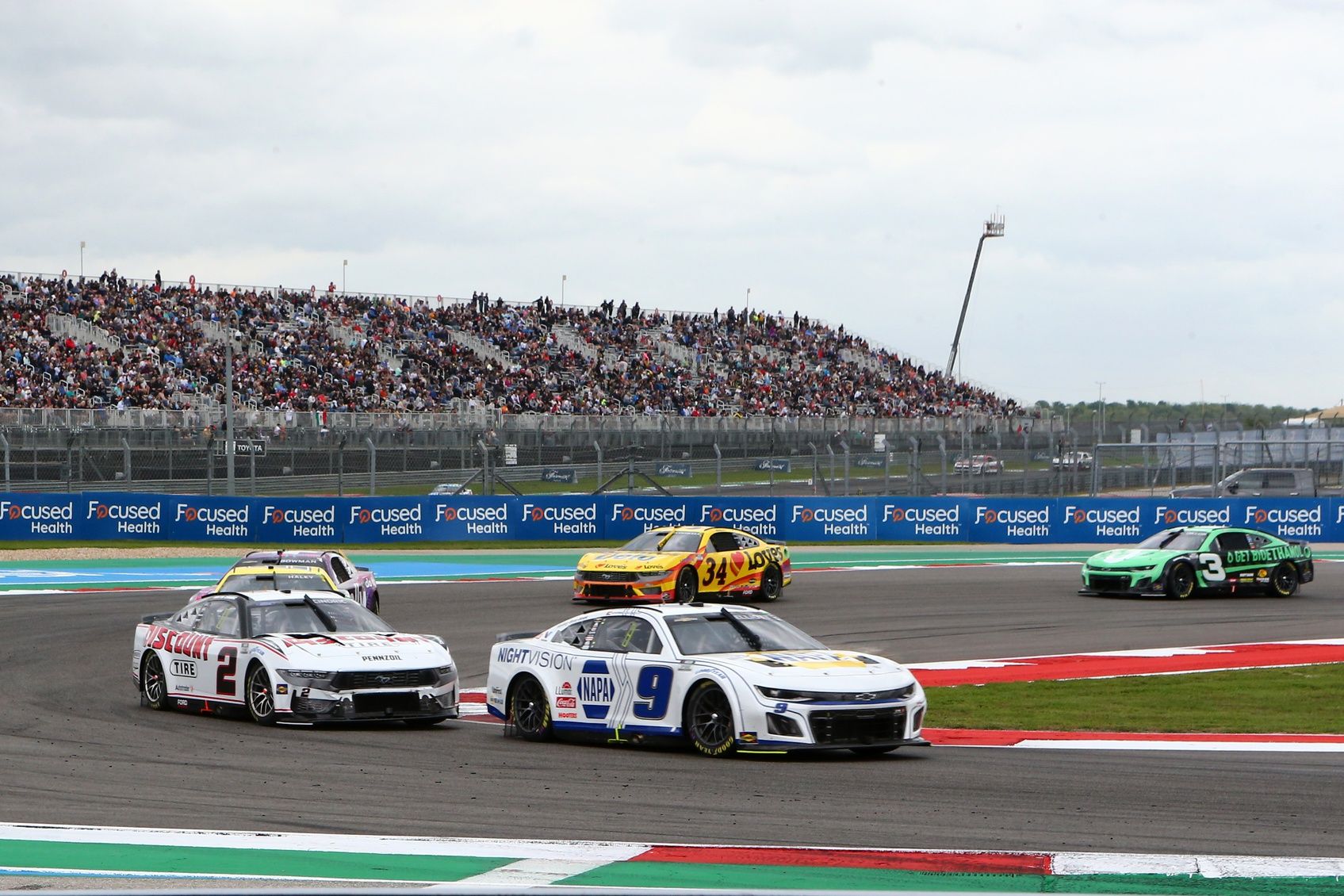 NASCAR Cup Series driver Chase Elliott (9) and driver Austin Cindric (2) in turn 15 during the EchoPark Automotive Grand Prix at Circuit of the Americas.