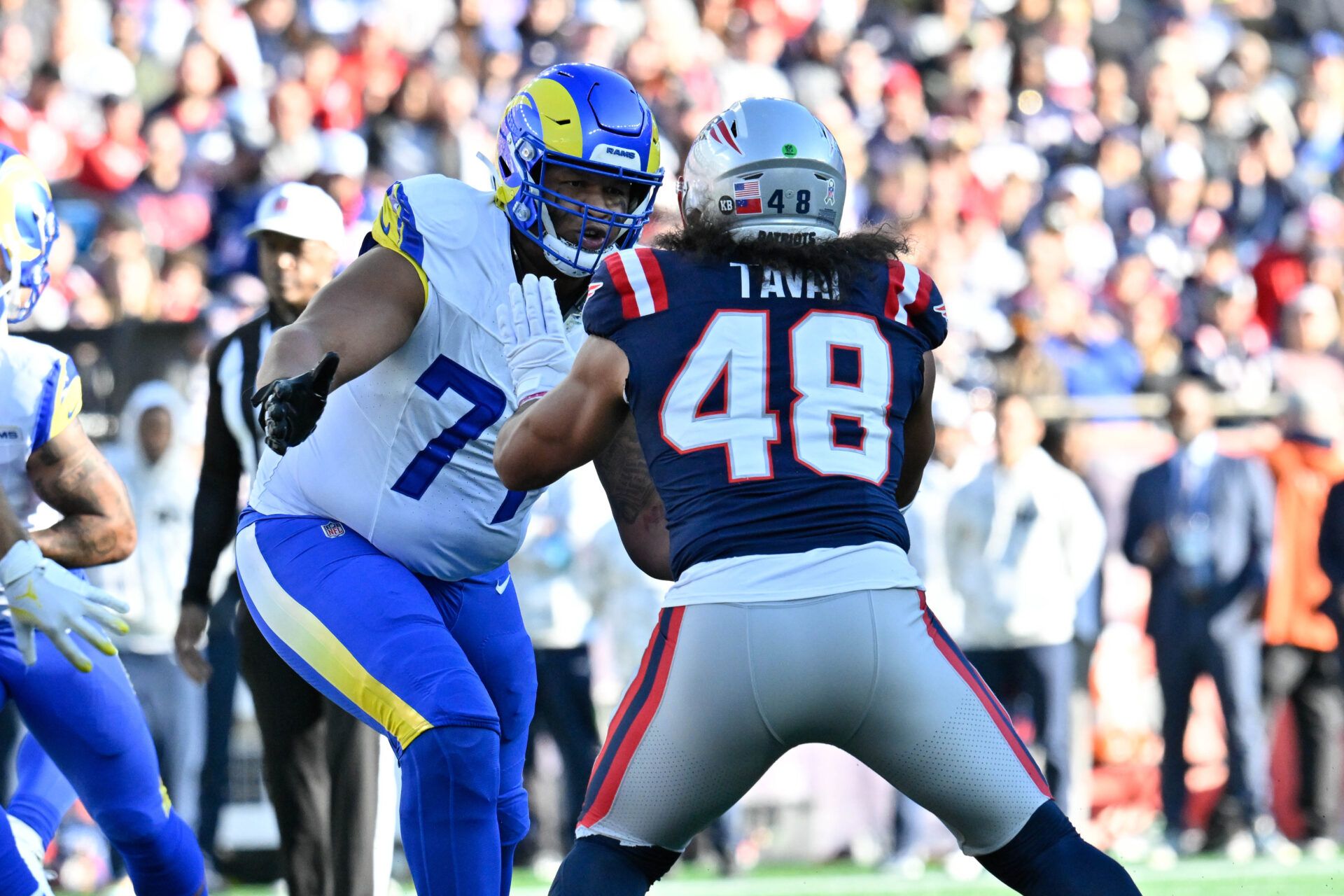 Nov 17, 2024; Foxborough, Massachusetts, USA; Los Angeles Rams offensive tackle Alaric Jackson (77) blocks New England Patriots linebacker Jahlani Tavai (48) during the first half at Gillette Stadium. Mandatory Credit: Eric Canha-Imagn Images