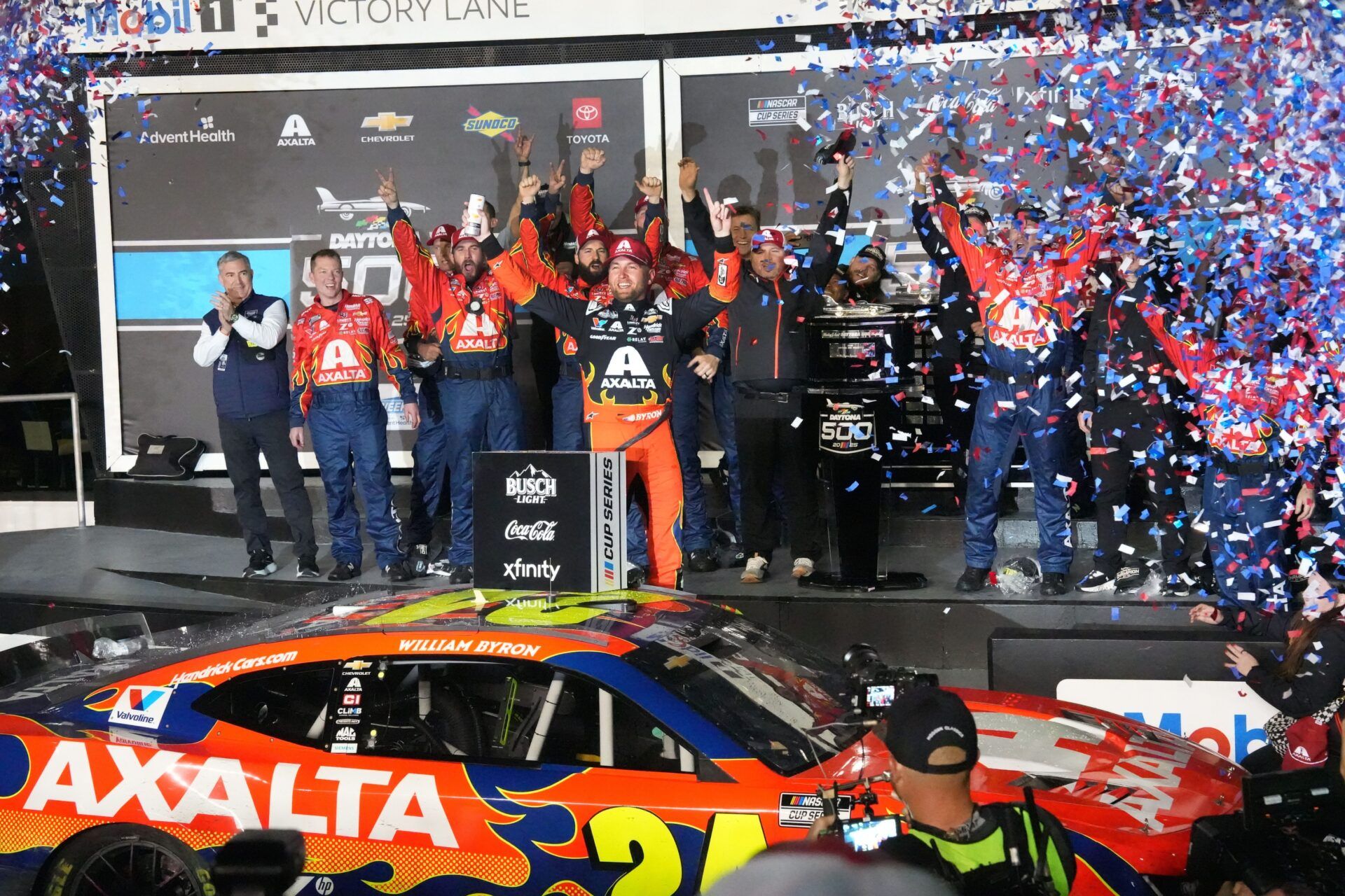 William Byron climbs out of his no. 24 Chevrolet in Mobil 1 Victory Lane, Sunday February 16, 2025 as confetti fills the air after winning the Daytona 500 at Daytona International Speedway.