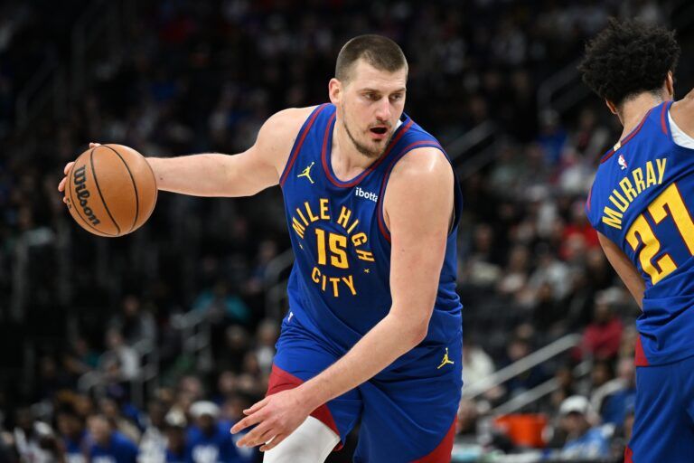 Denver Nuggets center Nikola Jokic (15) gets ready to drive to the basket against the Detroit Pistons in the first quarter at Little Caesars Arena.