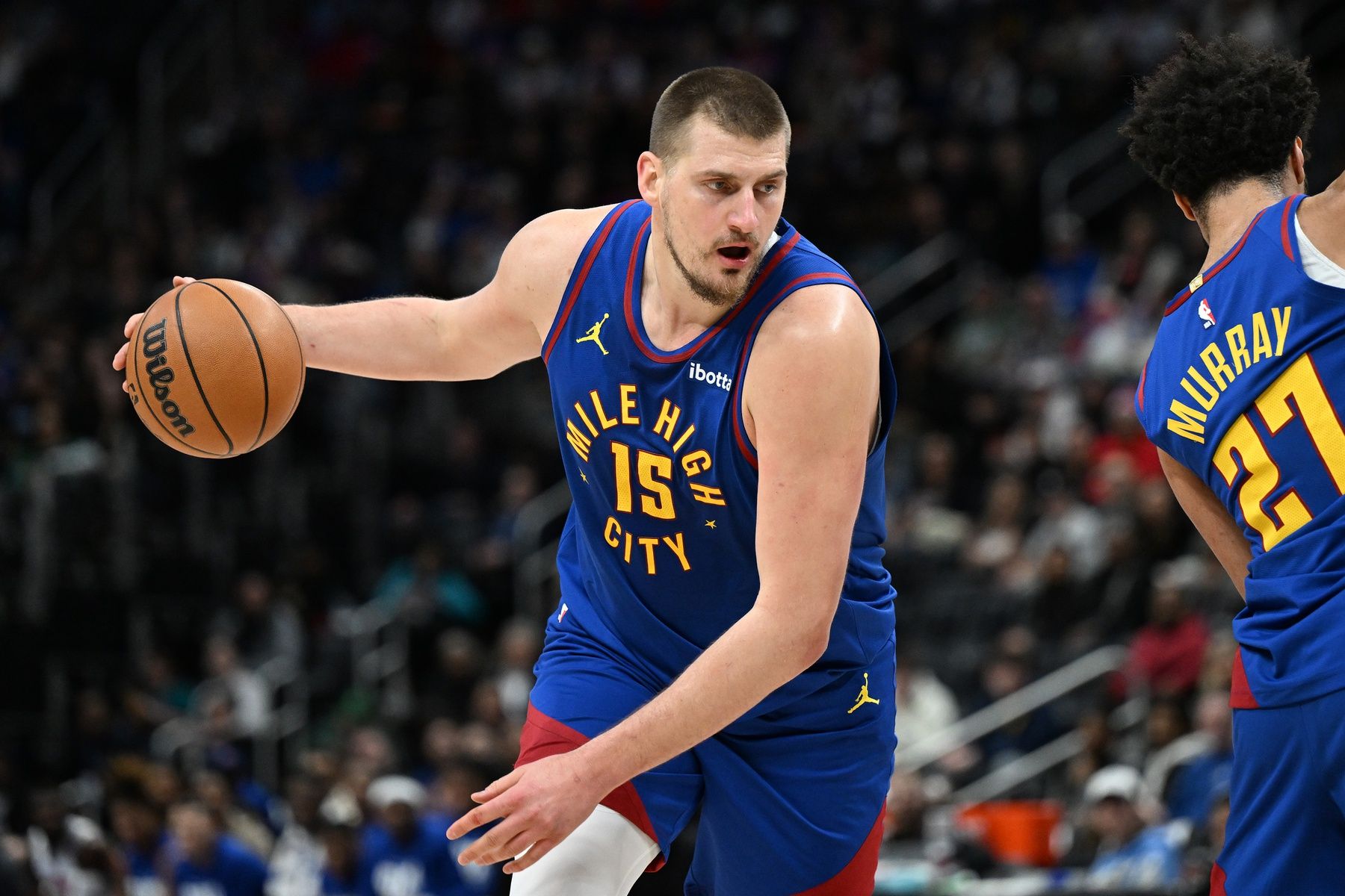 Denver Nuggets center Nikola Jokic (15) gets ready to drive to the basket against the Detroit Pistons in the first quarter at Little Caesars Arena.