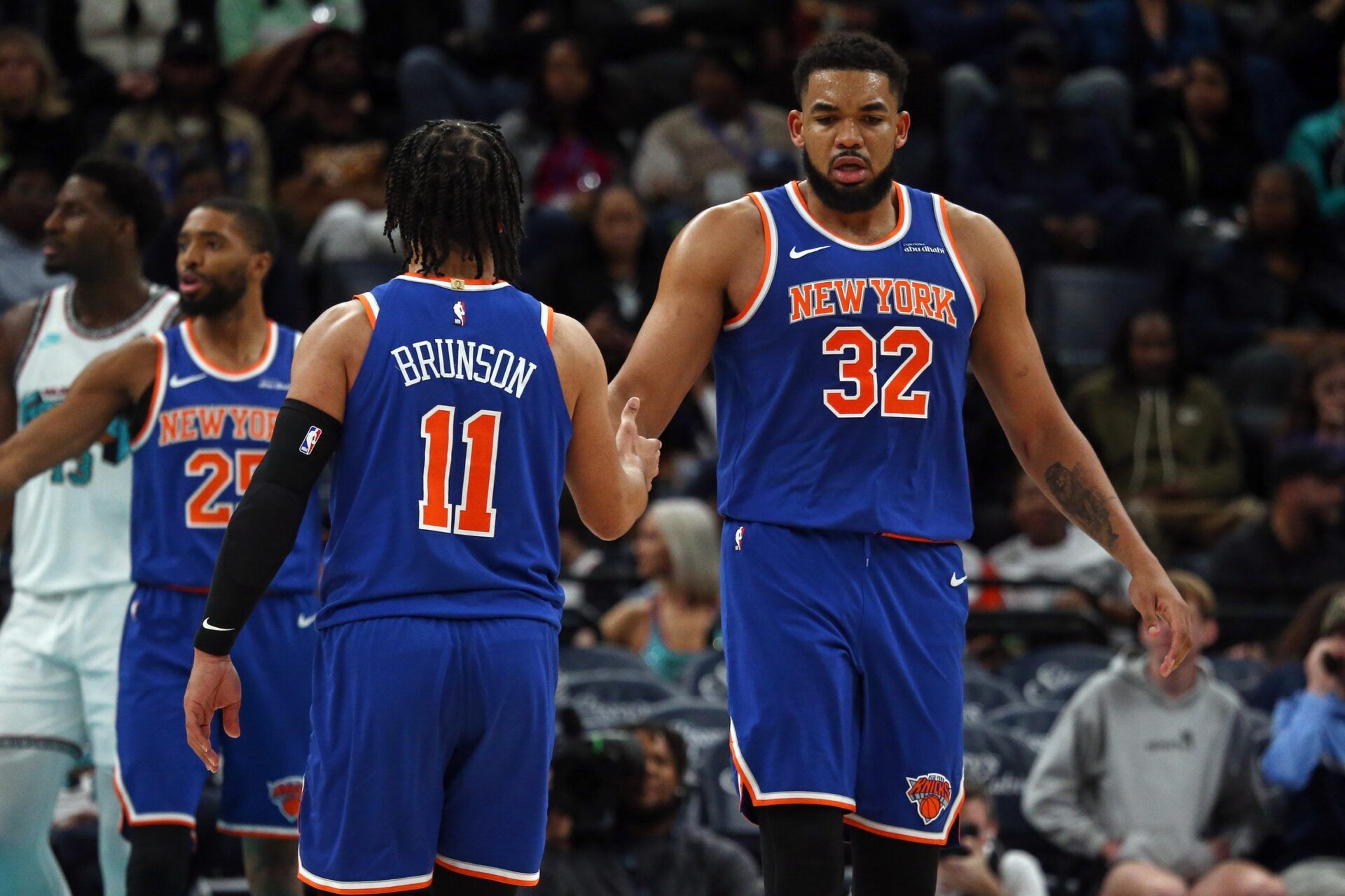 New York Knicks center Karl-Anthony Towns (32) reacts with guard Jalen Brunson (11) during the third quarter against the Memphis Grizzlies at FedExForum.