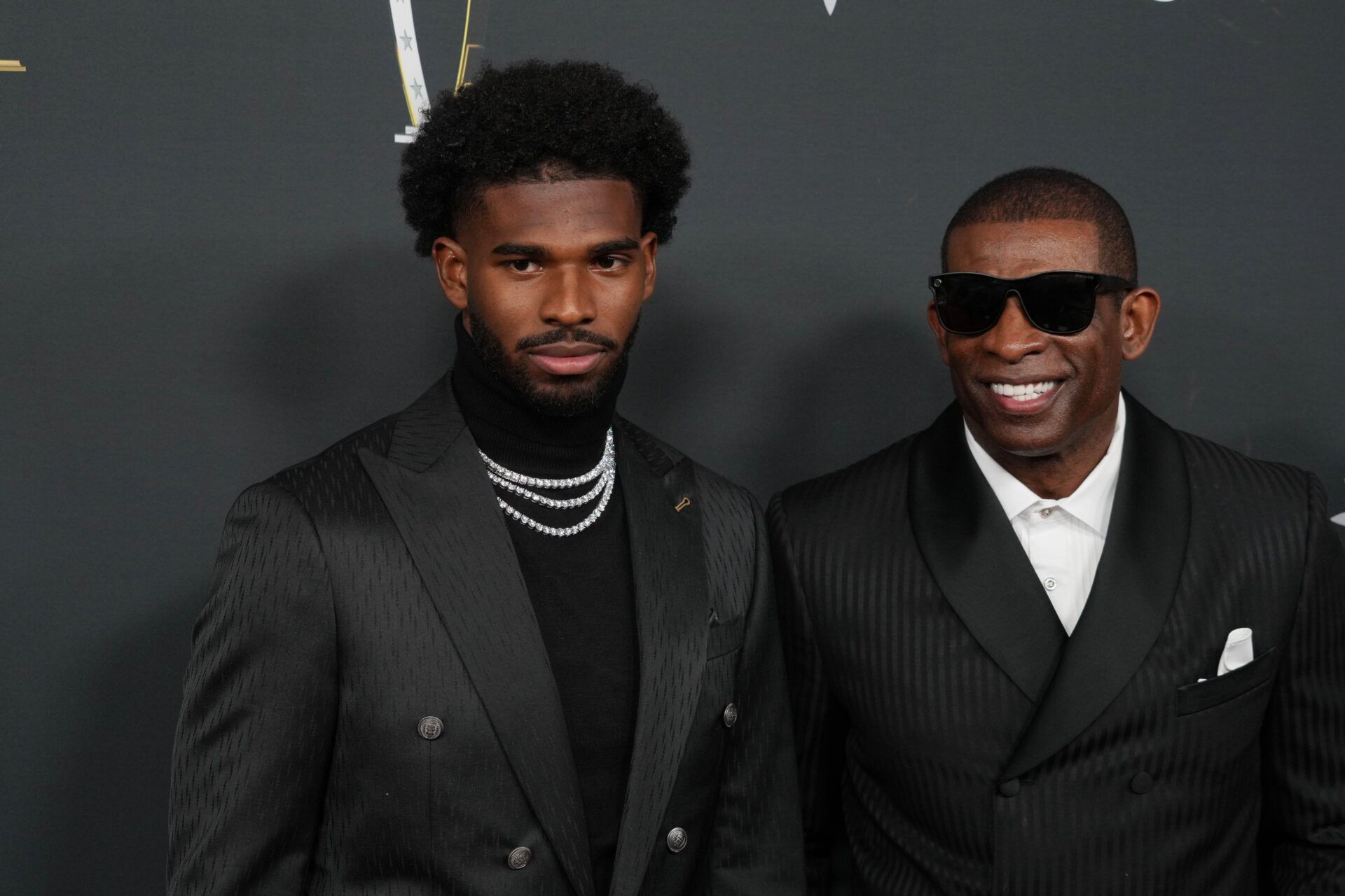 Deion Sanders (right) with his son Shedeur Sanders on the red carpet before Super Bowl LIX NFL Honors at Saenger Theatre.