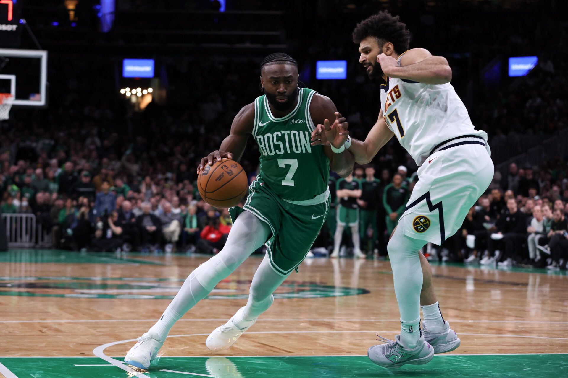 Jaylen Brown led the Boston Celtics to a 110-103 win over the Denver Nuggets, ending their two-game losing streak despite his injury concerns.