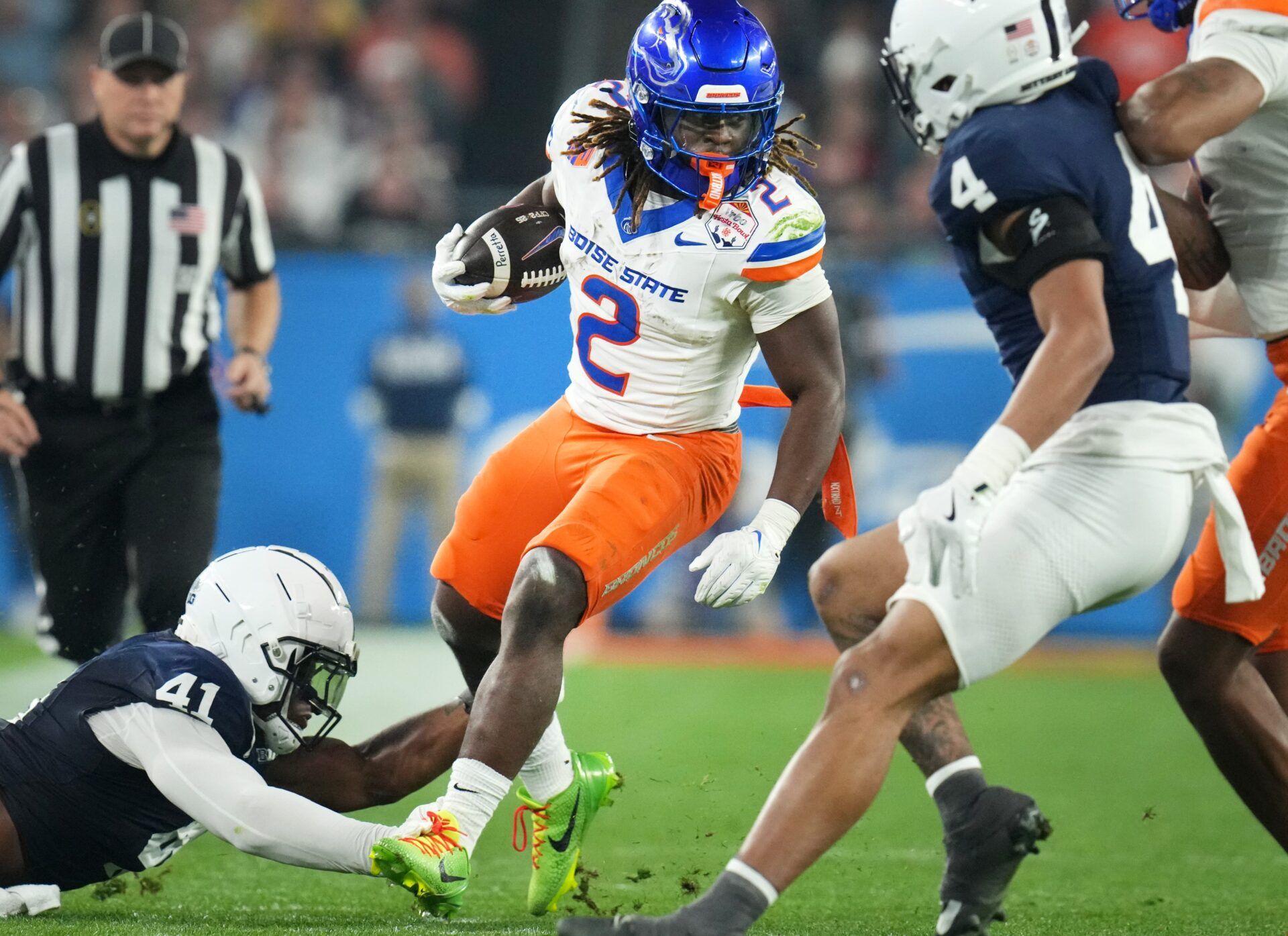 LAS VEGAS RAIDERS: Boise State Broncos running back Ashton Jeanty (2) runs past Penn State Nittany Lions linebacker Kobe King (41) during their Vrbo Fiesta Bowl matchup at State Farm Stadium on Dec. 31, 2024.