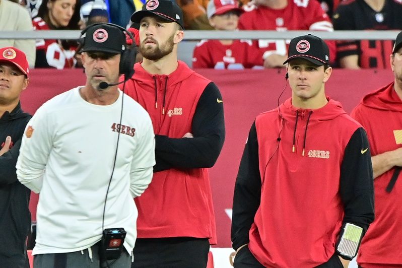 San Francisco 49ers quarterback Brock Purdy (right) and head coach Kyle Shanahan (left) look on the in second half against the Arizona Cardinals at State Farm Stadium.