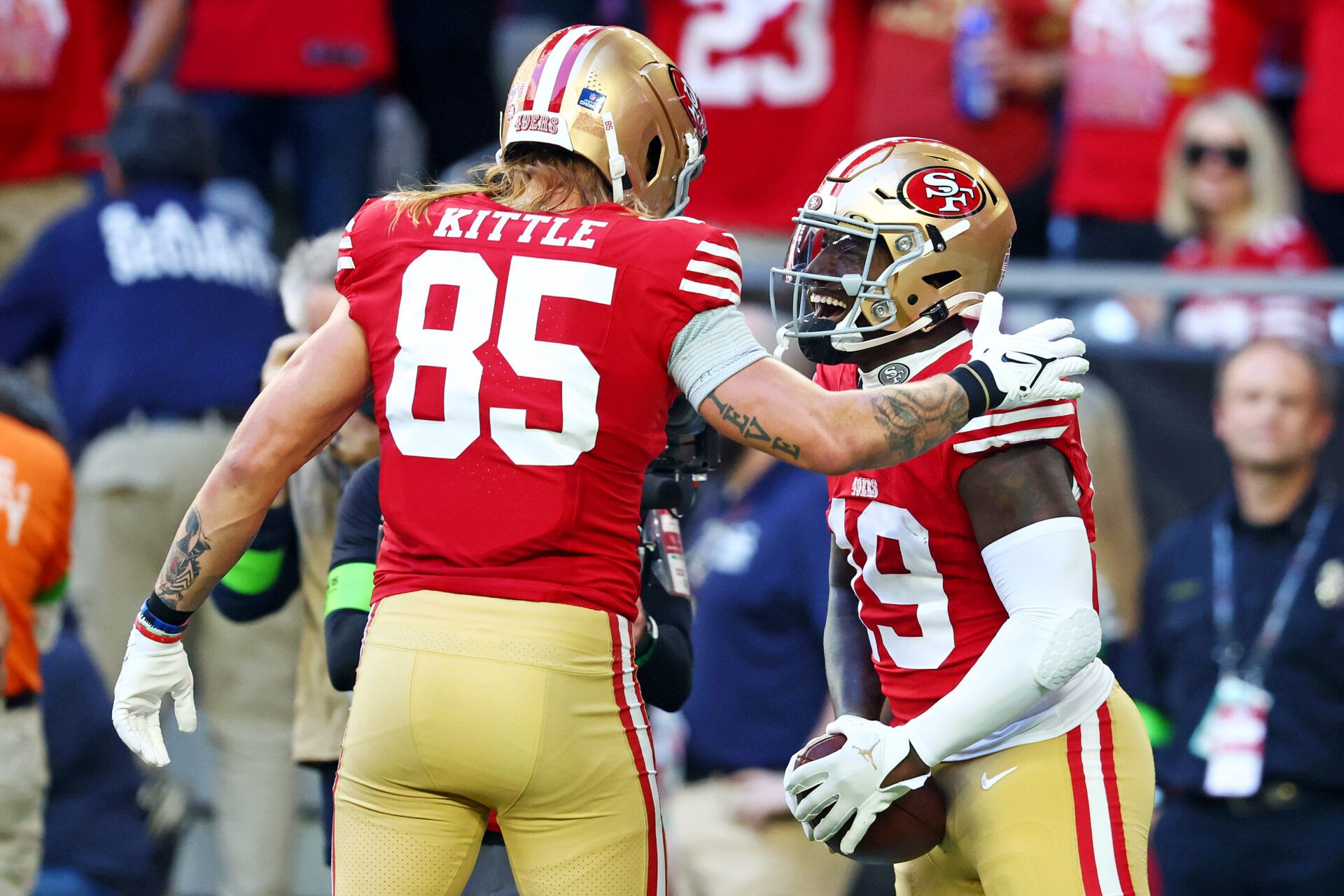 Dec 17, 2023; Glendale, Arizona, USA; San Francisco 49ers wide receiver Deebo Samuel (19) celebrates with San Francisco 49ers tight end George Kittle (85) after scoring a touchdown during the first quarter against the Arizona Cardinals at State Farm Stadium. Mandatory Credit: Mark J. Rebilas-USA TODAY Sports