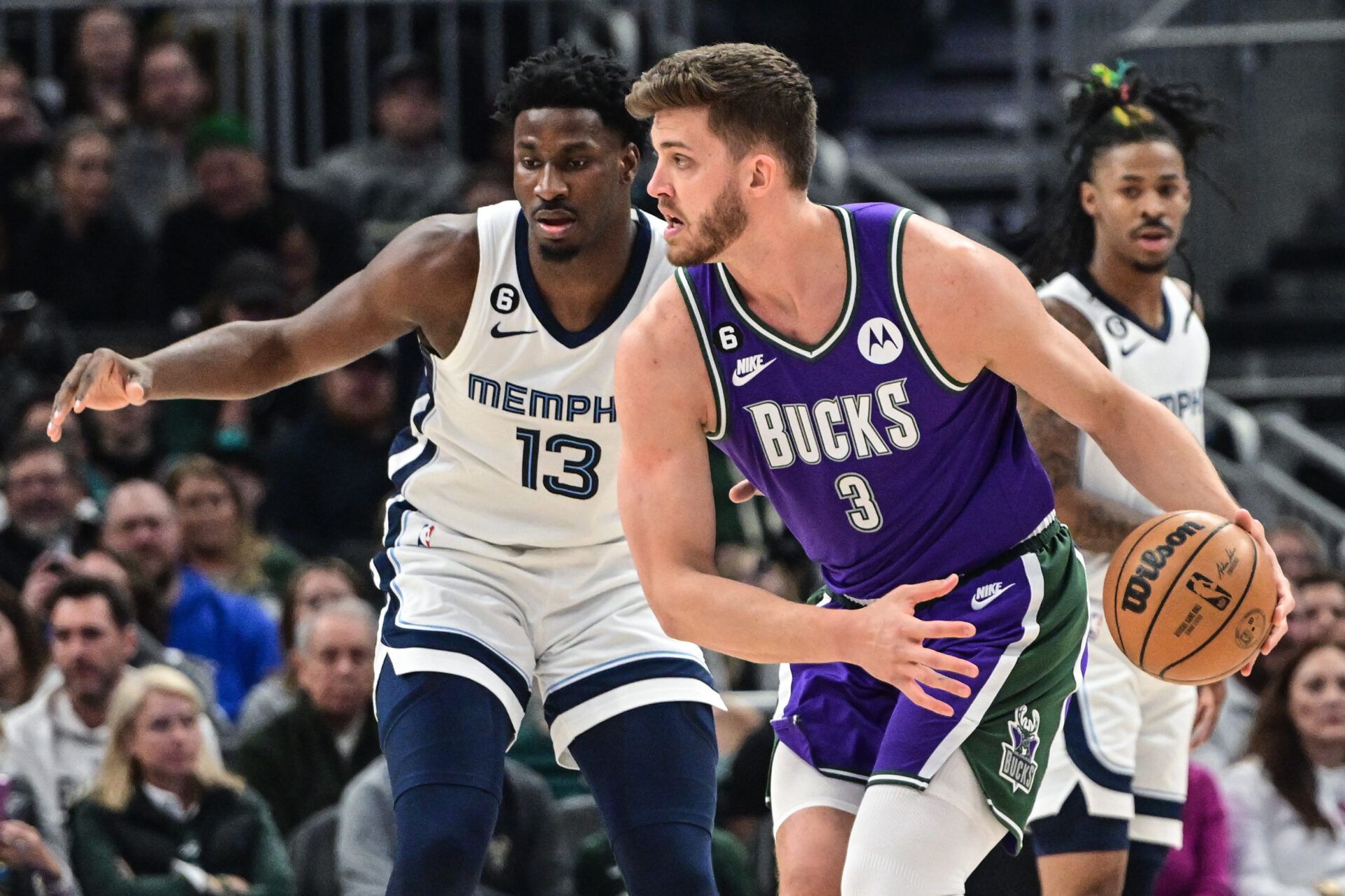 Apr 7, 2023; Milwaukee, Wisconsin, USA; Milwaukee Bucks forward Meyers Leonard (3) drives toward the basket against Memphis Grizzlies forward Jaren Jackson Jr. (13) in the first quarter at Fiserv Forum. Mandatory Credit: Benny Sieu-USA TODAY Sports