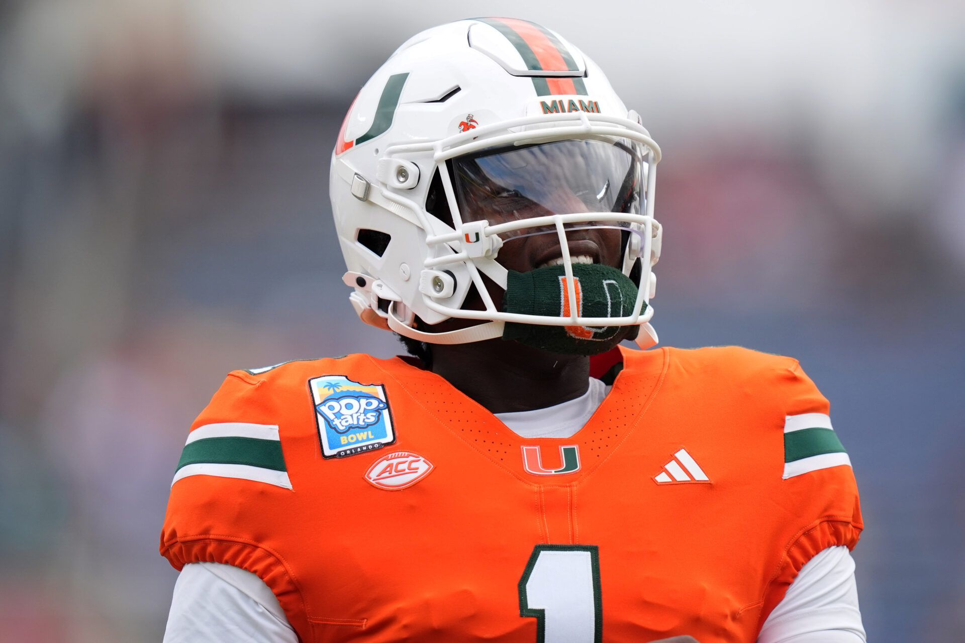 Dec 28, 2024; Orlando, FL, USA; Miami Hurricanes quarterback Cam Ward (1) warms up prior to the game against the Iowa State Cyclones at Camping World Stadium. Mandatory Credit: Jasen Vinlove-Imagn Images