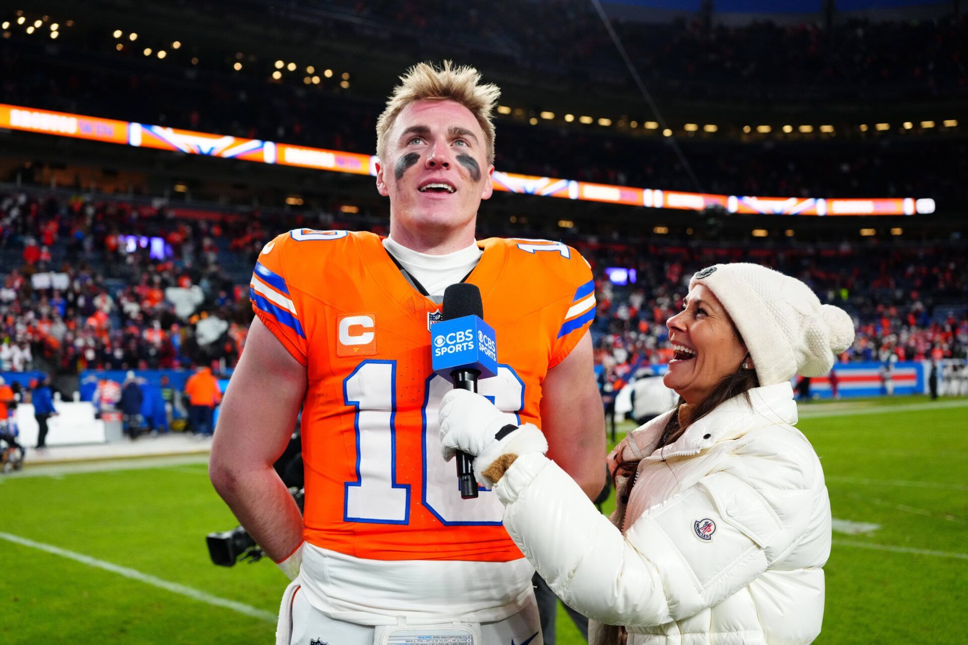 CBS Sports reporter Tracy Wolfson interviews Denver Broncos quarterback Bo Nix (10) following the win against the Kansas City Chiefs at Empower Field at Mile High.