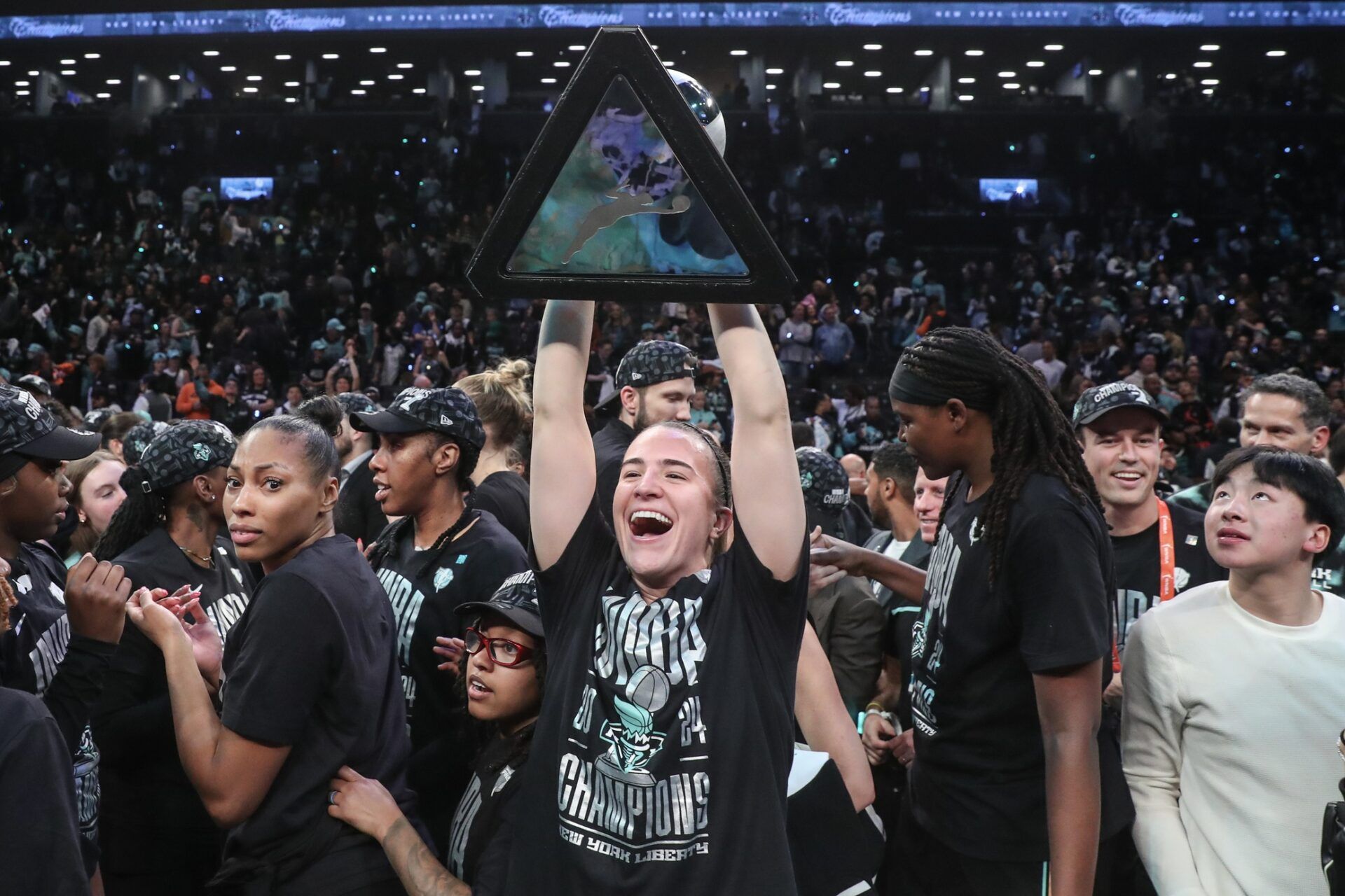 New York Liberty guard Sabrina Ionescu (20) celebrates after defeating the Minnesota Lynx in overtime to win the 2024 WNBA Finals at Barclays Center.