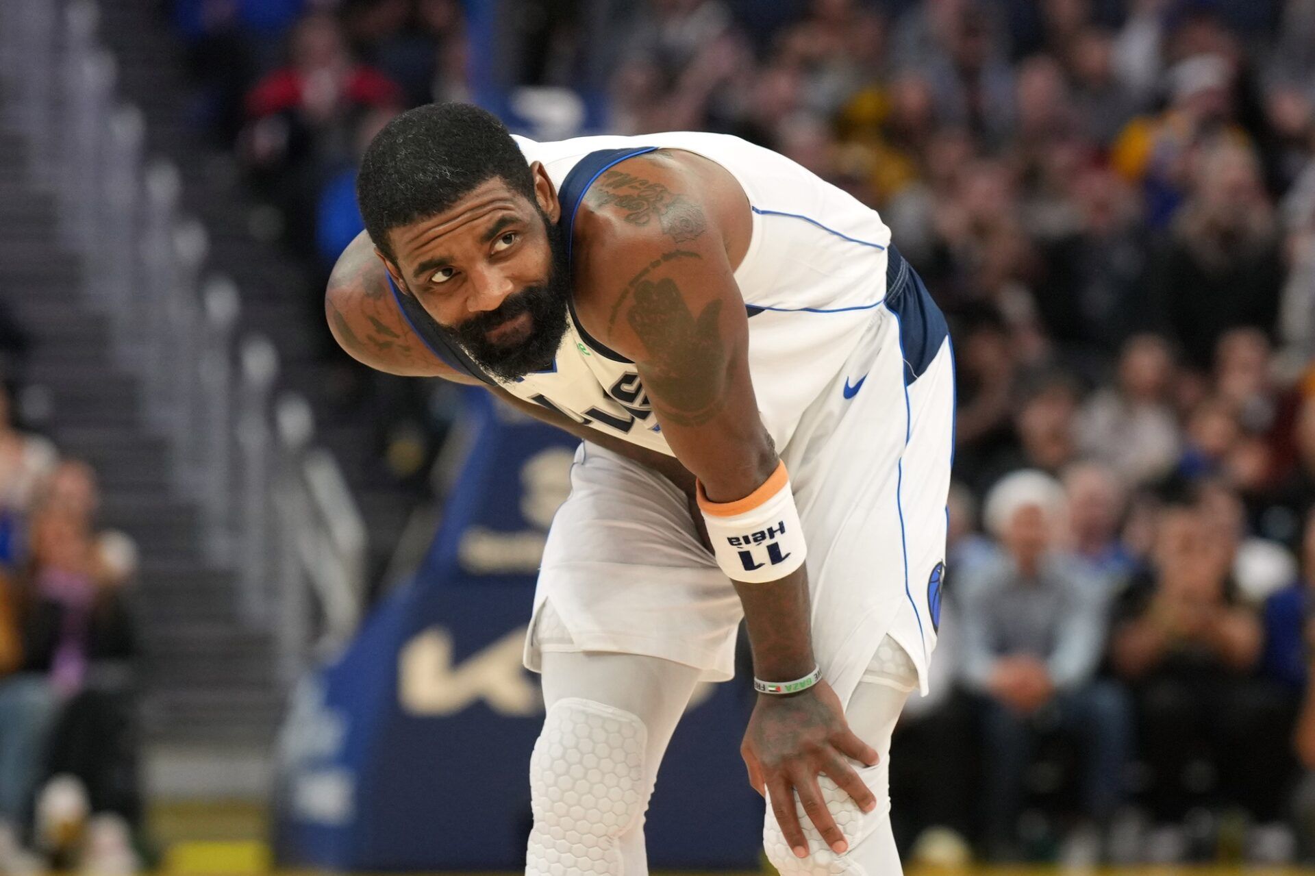 Dallas Mavericks guard Kyrie Irving (11) reacts after suffering an injury during the fourth quarter against the Golden State Warriors at Chase Center.