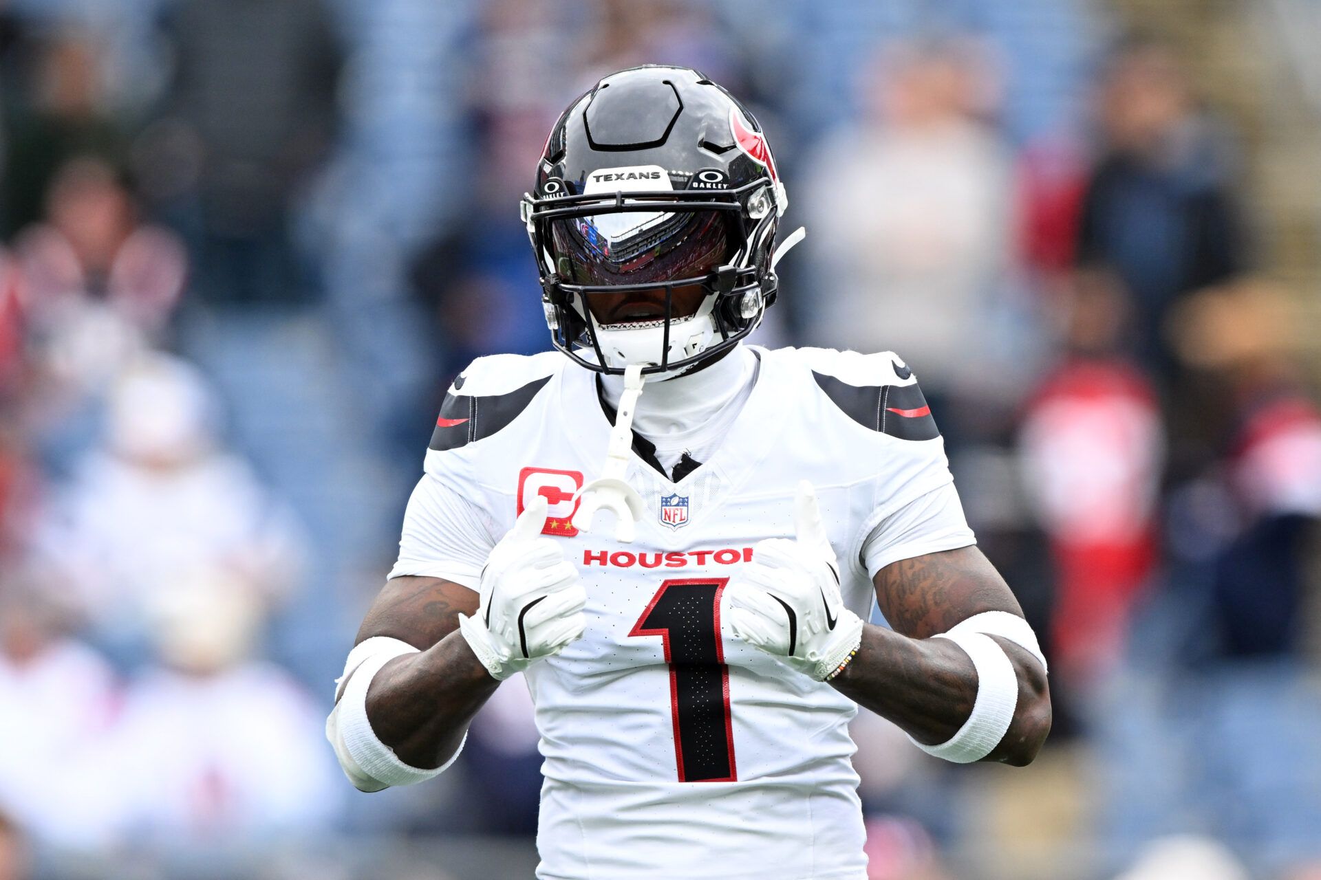 Oct 13, 2024; Foxborough, Massachusetts, USA; Houston Texans wide receiver Stefon Diggs (1) reacts before a game against the New England Patriots at Gillette Stadium. Mandatory Credit: Brian Fluharty-Imagn Images