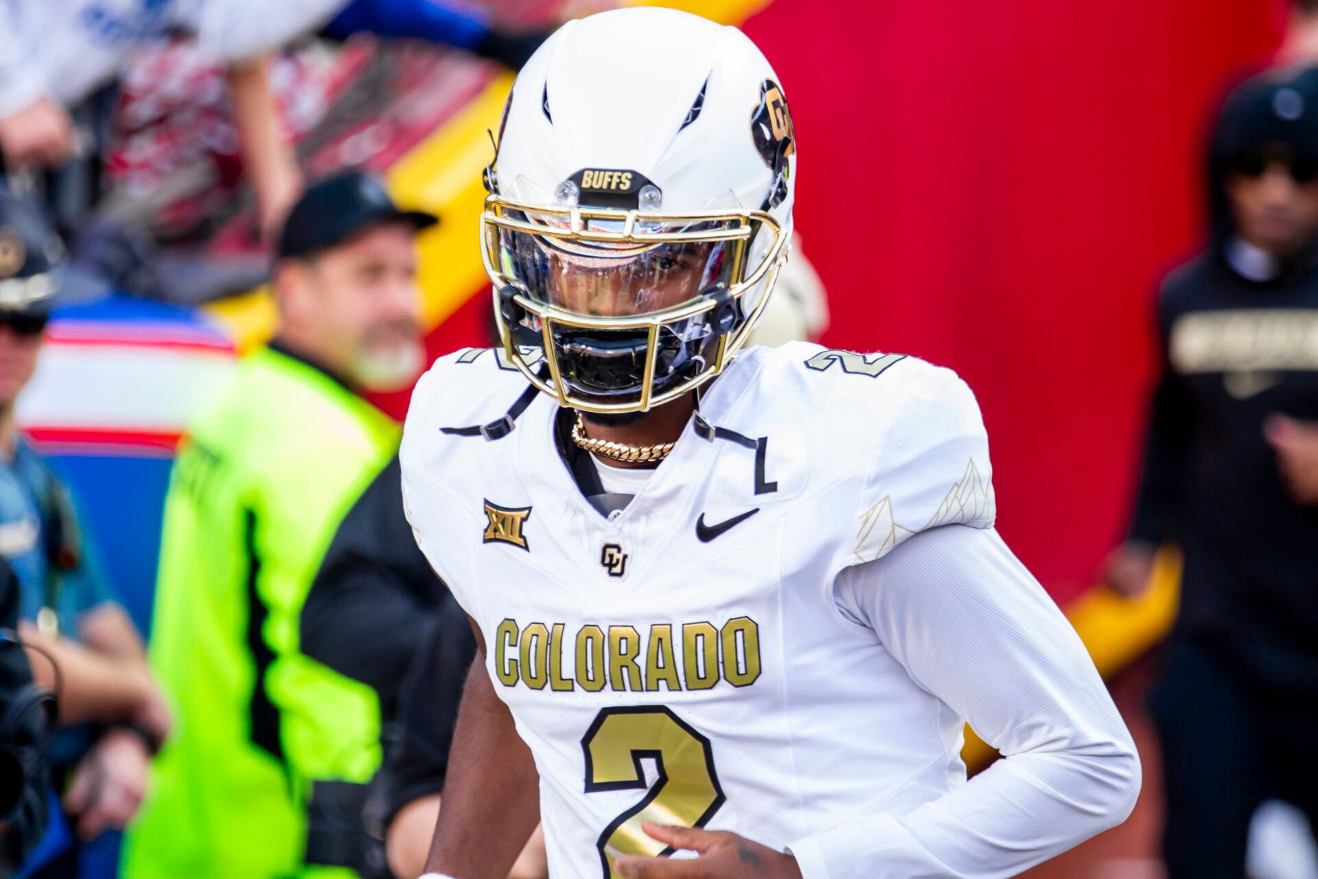 Nov 23, 2024; Kansas City, Missouri, USA; Colorado quarterback Shedeur Sanders (2) jogs onto the field during the game against the Kansas Jayhawks at GEHA Field at Arrowhead Stadium. Mandatory Credit: Nick Tre. Smith-Imagn Images