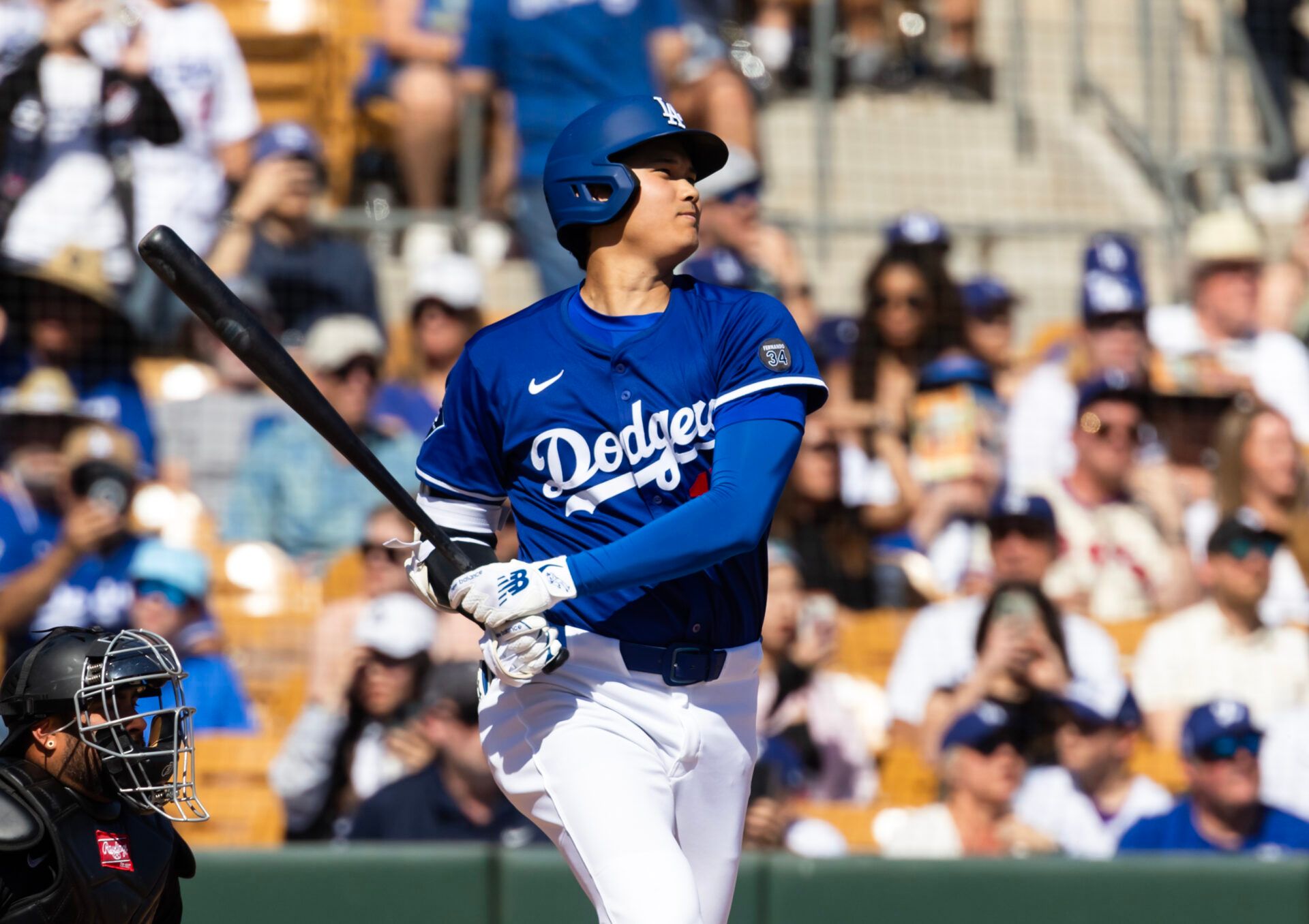 Mar 2, 2025; Phoenix, Arizona, USA; Los Angeles Dodgers designated hitter Shohei Ohtani (17) hits a single against the Chicago White Sox during a spring training game at Camelback Ranch-Glendale. Mandatory Credit: Mark J. Rebilas-Imagn Images