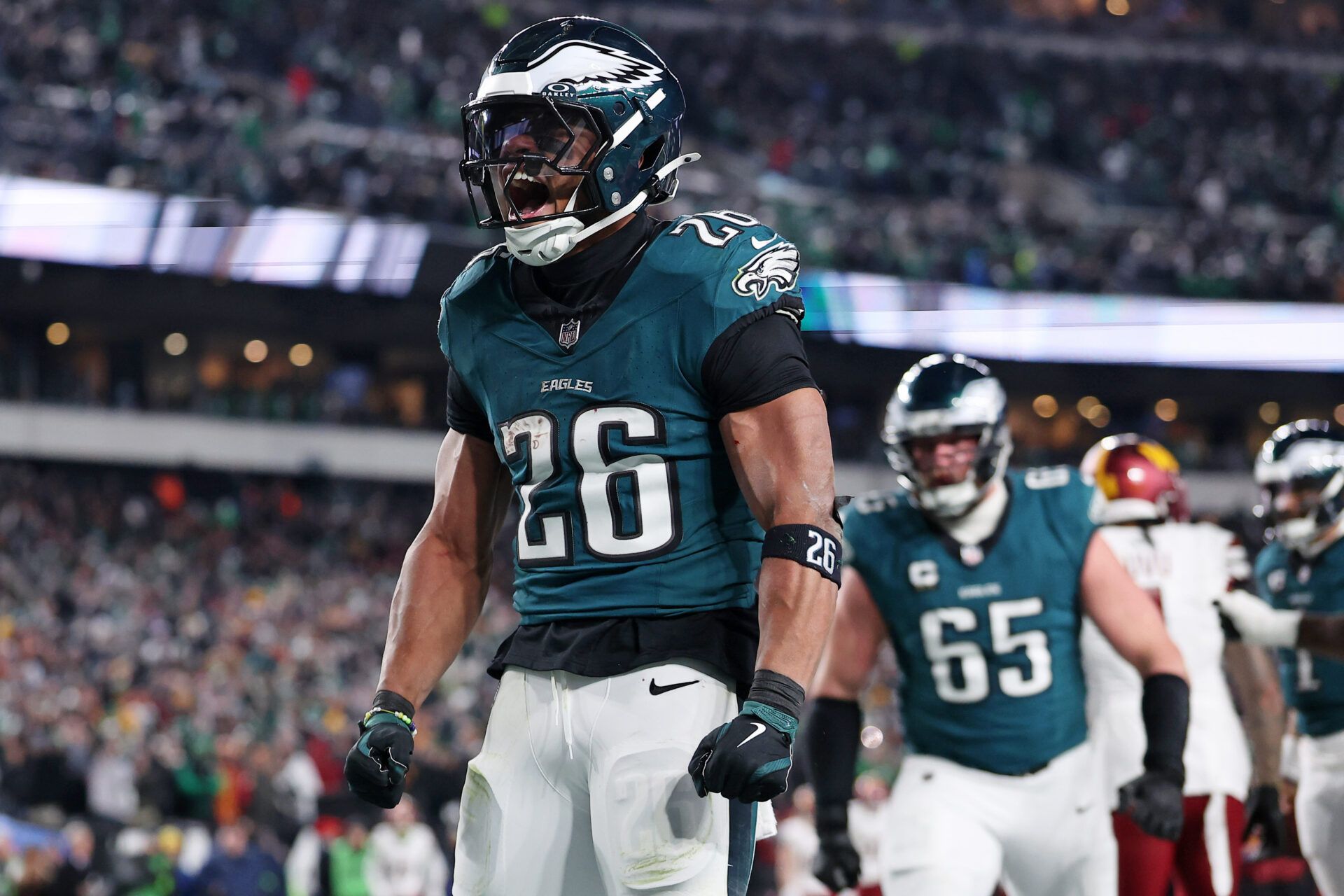 Jan 26, 2025; Philadelphia, PA, USA; Philadelphia Eagles running back Saquon Barkley (26) celebrates after a touchdown against the Washington Commanders during the second half in the NFC Championship game at Lincoln Financial Field. Mandatory Credit: Bill Streicher-Imagn Images