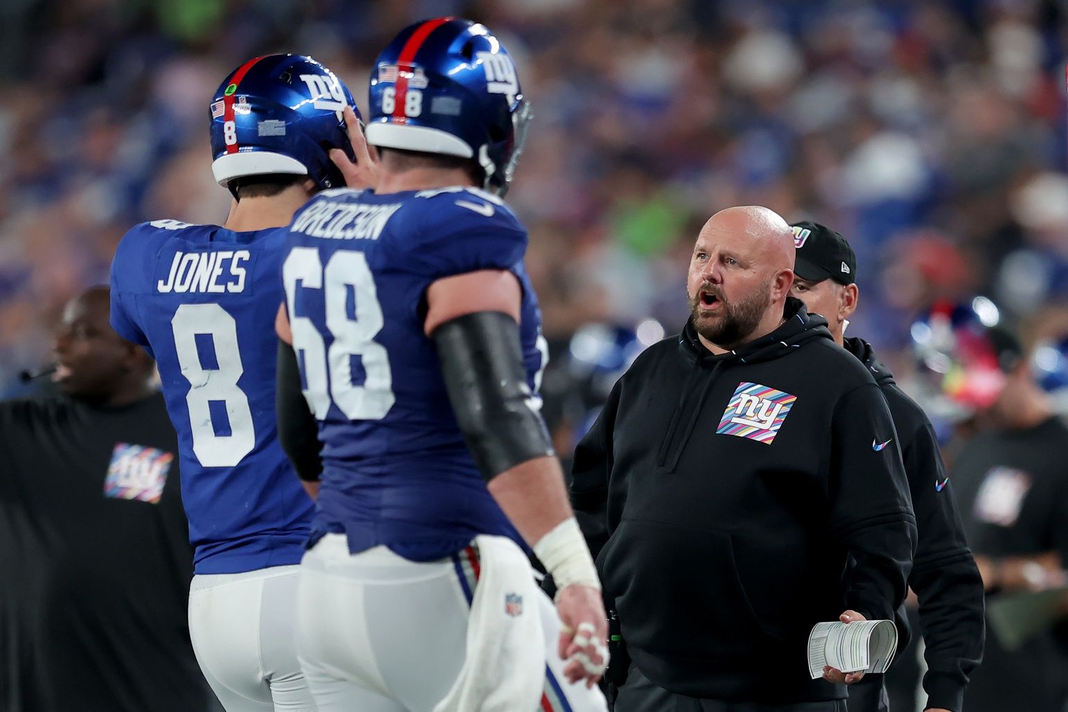 New York Giants head coach Brian Daboll talks to quarterback Daniel Jones (8) as he comes off the field during the second quarter against the Seattle Seahawks at MetLife Stadium.