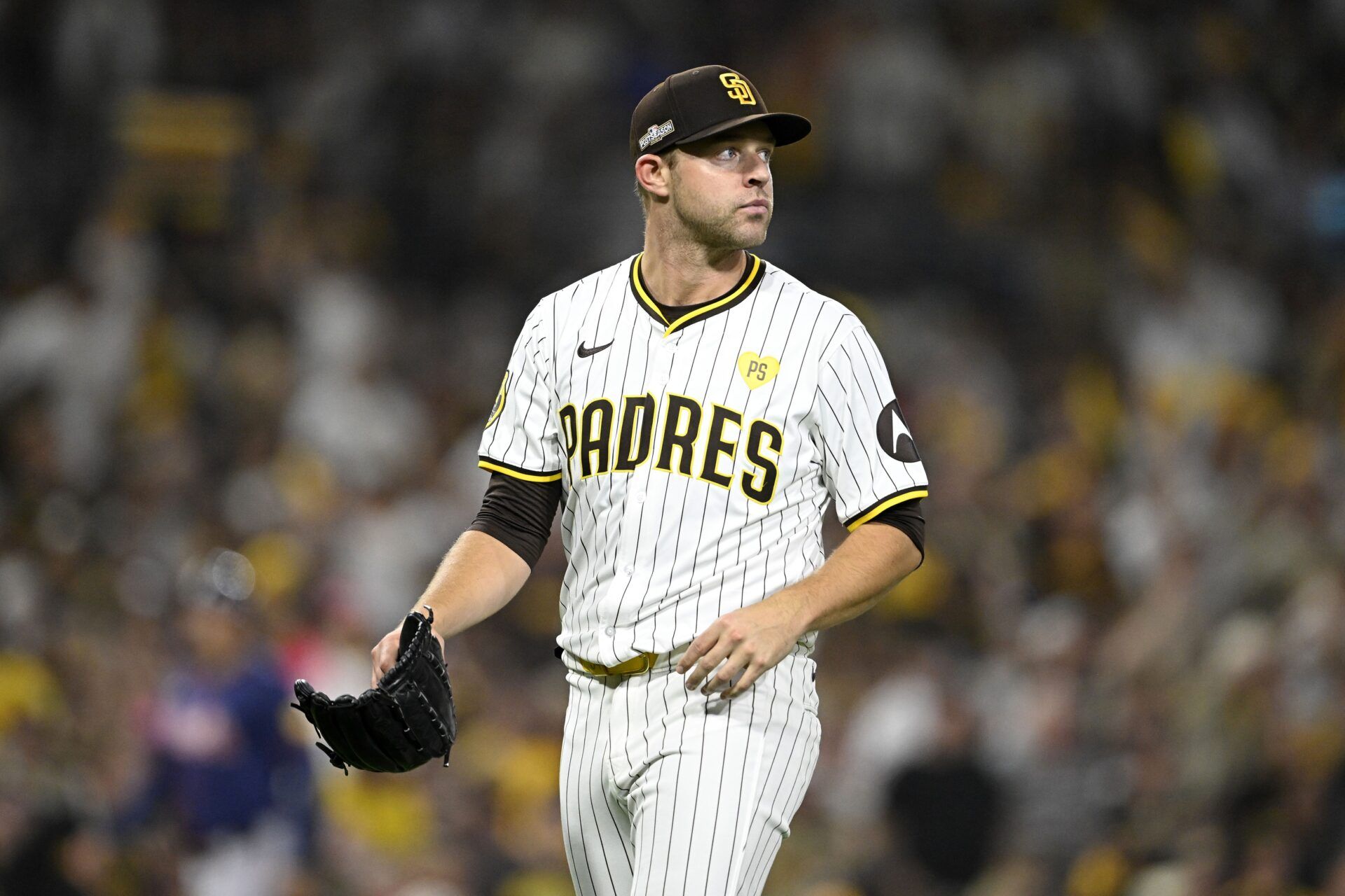 San Diego Padres pitcher Michael King (34) walks off the field after the sixth inning against the Atlanta Braves in game one of the Wildcard round for the 2024 MLB Playoffs at Petco Park.