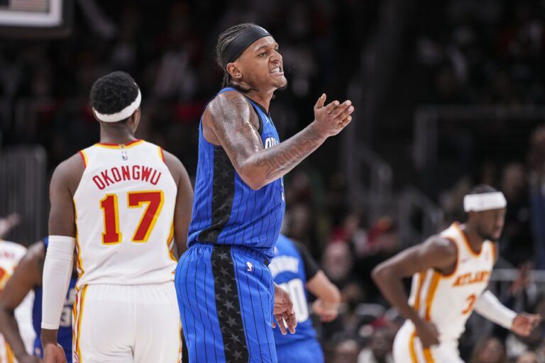 Orlando Magic forward Paolo Banchero (5) reacts after making a three point basket late in the game against the Atlanta Hawks during the second half at State Farm Arena.