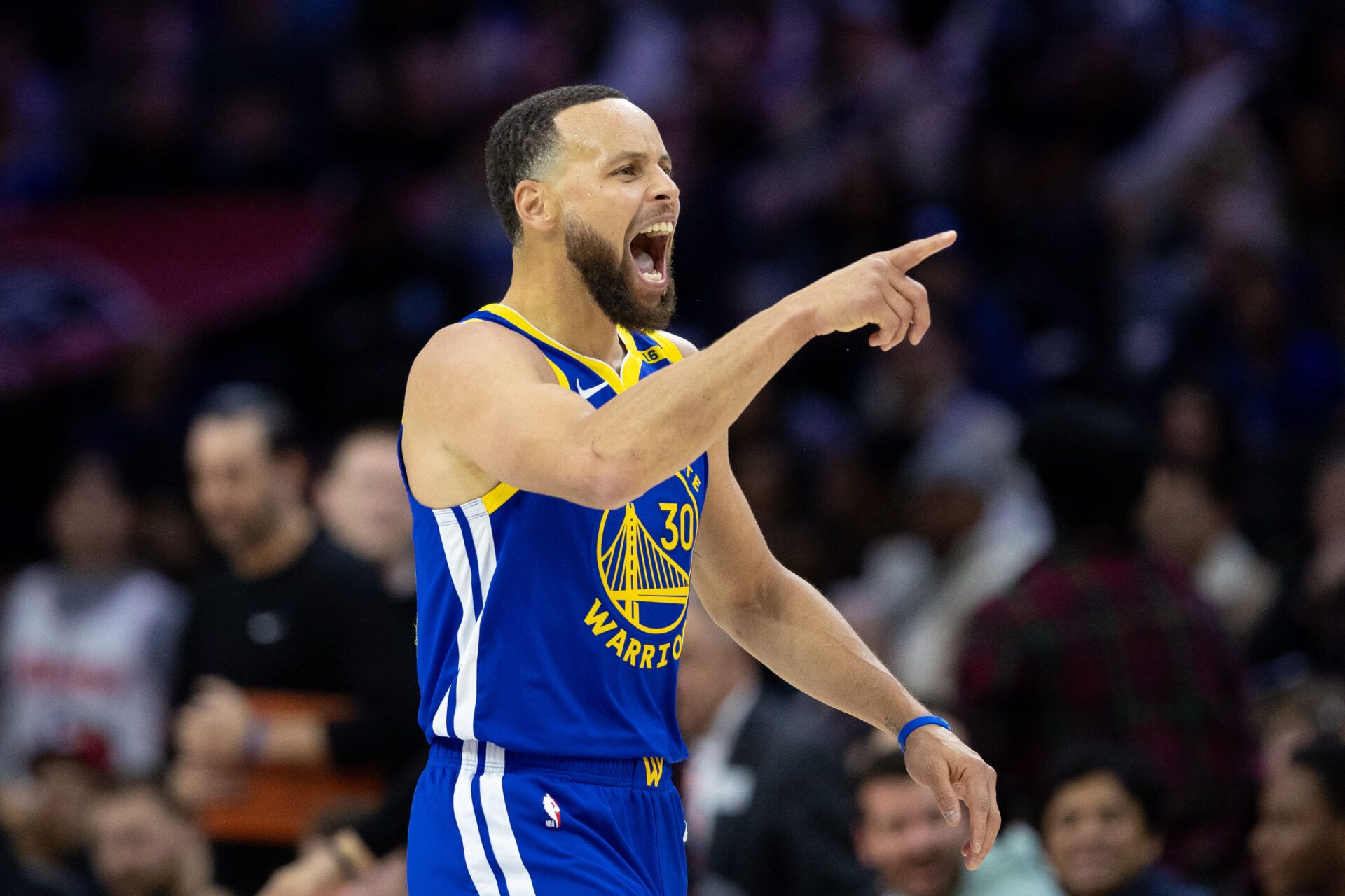 Mar 1, 2025; Philadelphia, Pennsylvania, USA; Golden State Warriors guard Stephen Curry (30) reacts after dunking the ball against the Philadelphia 76ers during the fourth quarter at Wells Fargo Center. Mandatory Credit: Bill Streicher-Imagn Images