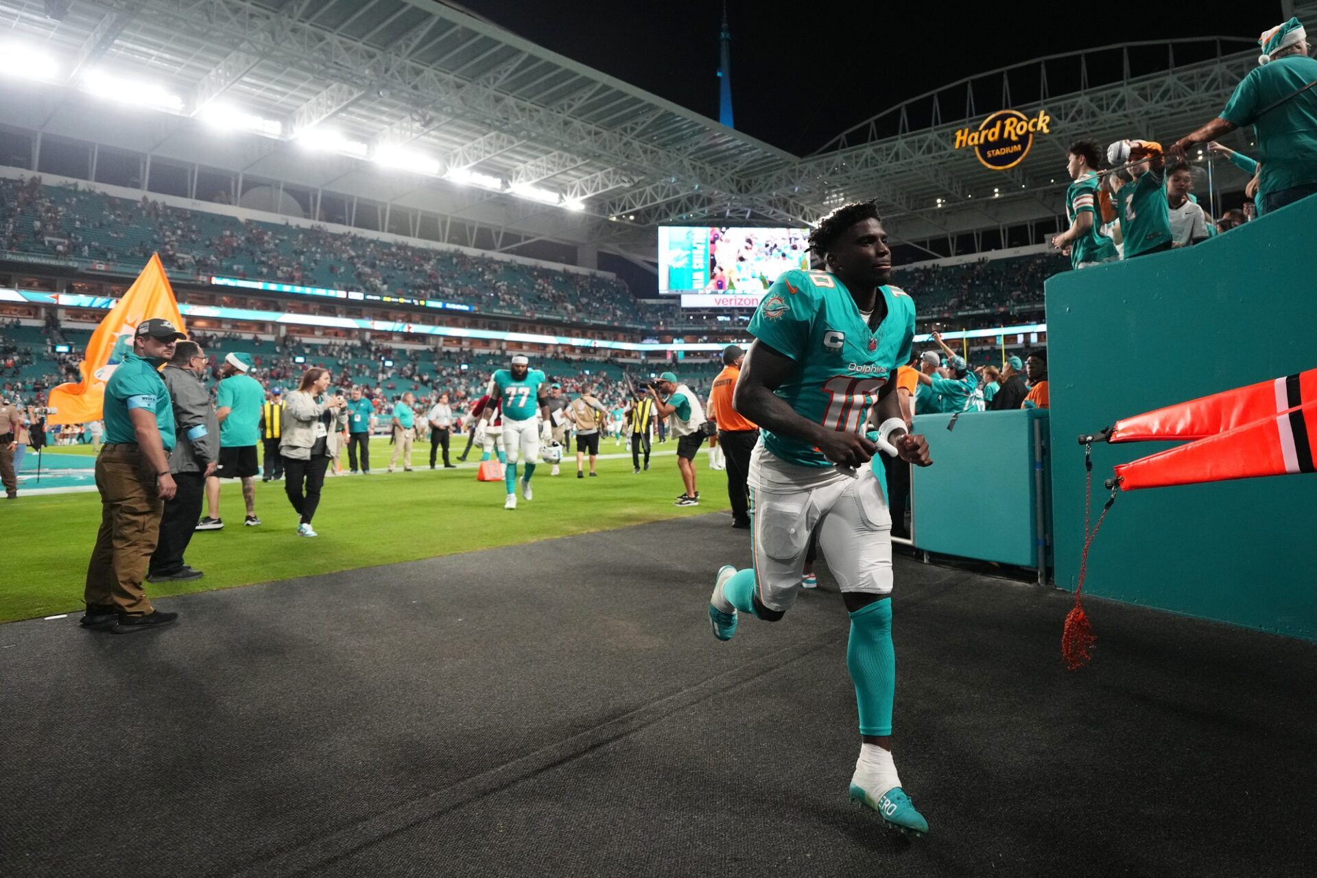 Miami Dolphins wide receiver Tyreek Hill (10) runs off the field after defeating the San Francisco 49ers at Hard Rock Stadium.