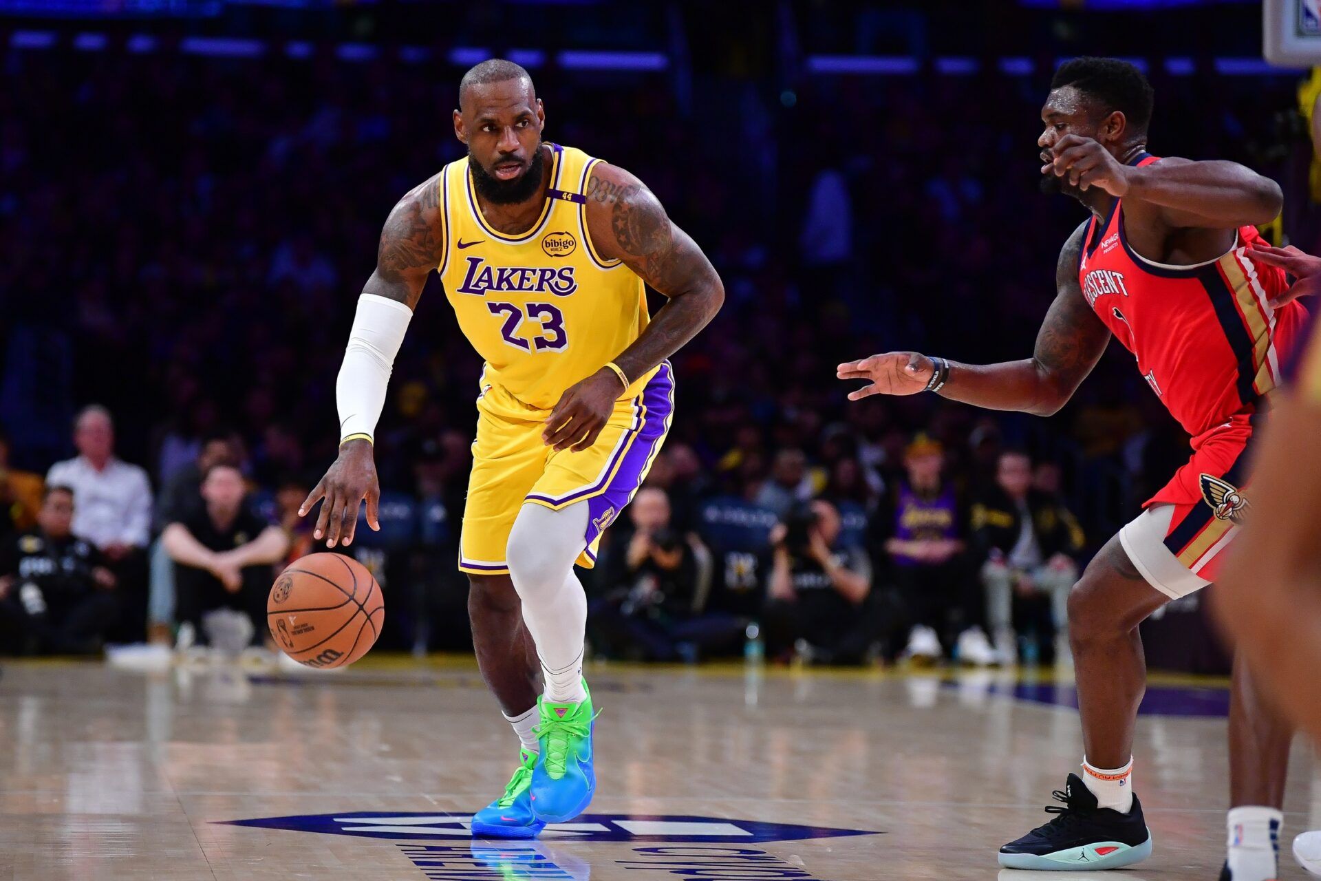 Los Angeles Lakers forward LeBron James (23) moves the ball against New Orleans Pelicans forward Zion Williamson (1) during the first half at Crypto.com Arena.