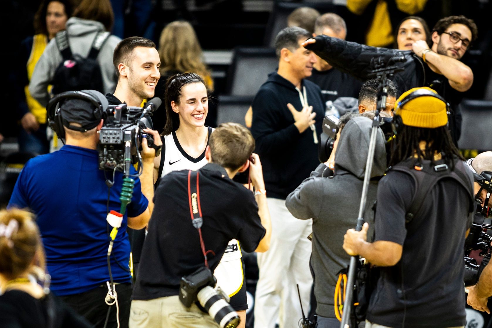 Iowa guard Caitlin Clark poses for a photo with Connor McCaffery after a NCAA Big Ten Conference women's basketball game against Michigan, Thursday, Feb. 15, 2024, at Carver-Hawkeye Arena in Iowa City, Iowa.