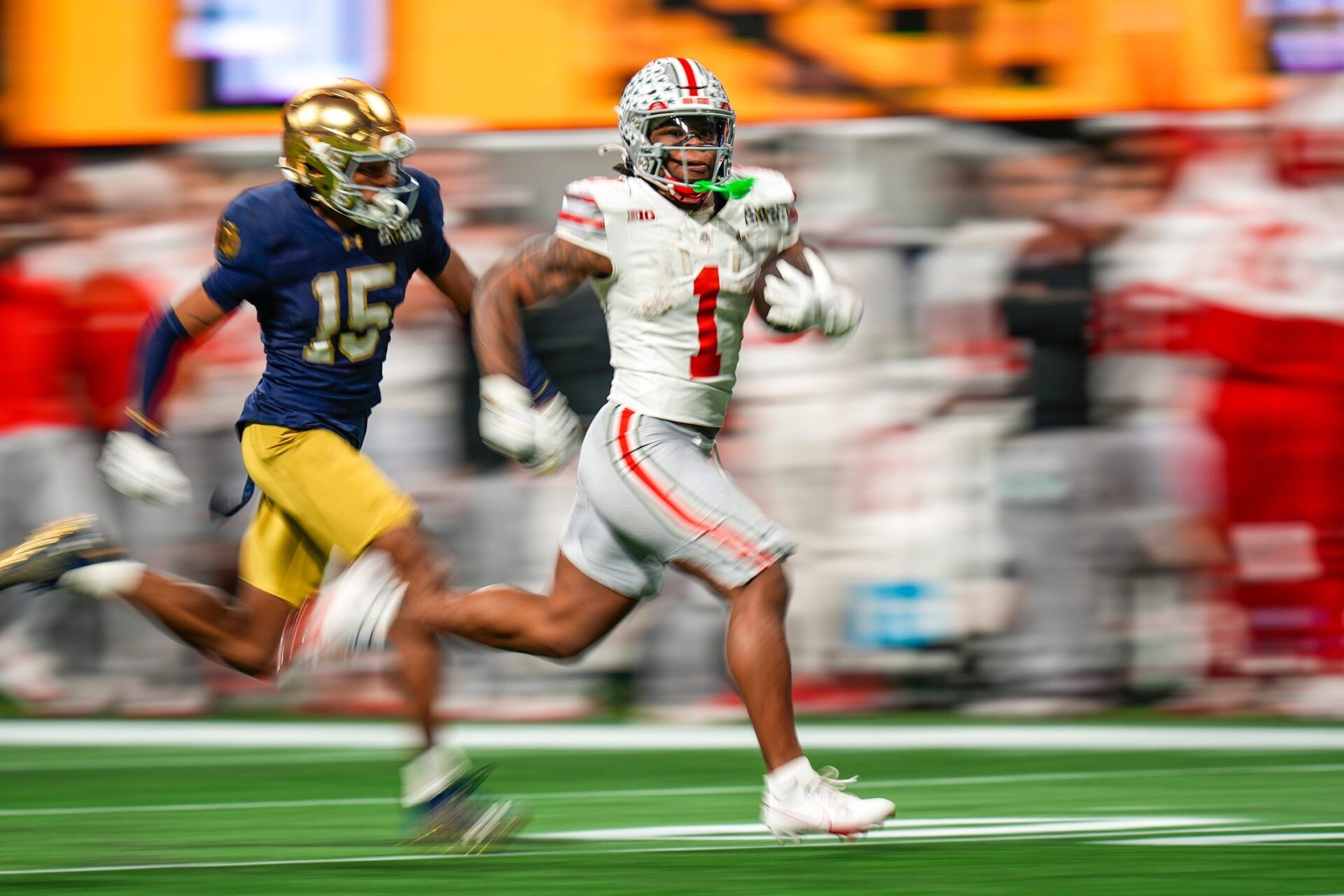 Ohio State Buckeyes running back Quinshon Judkins (1) gets away from the Notre Dame Fighting Irish defense for a long run in the third quarter during the College Football Playoff championship at Mercedes-Benz Stadium in Atlanta on January 20, 2025.