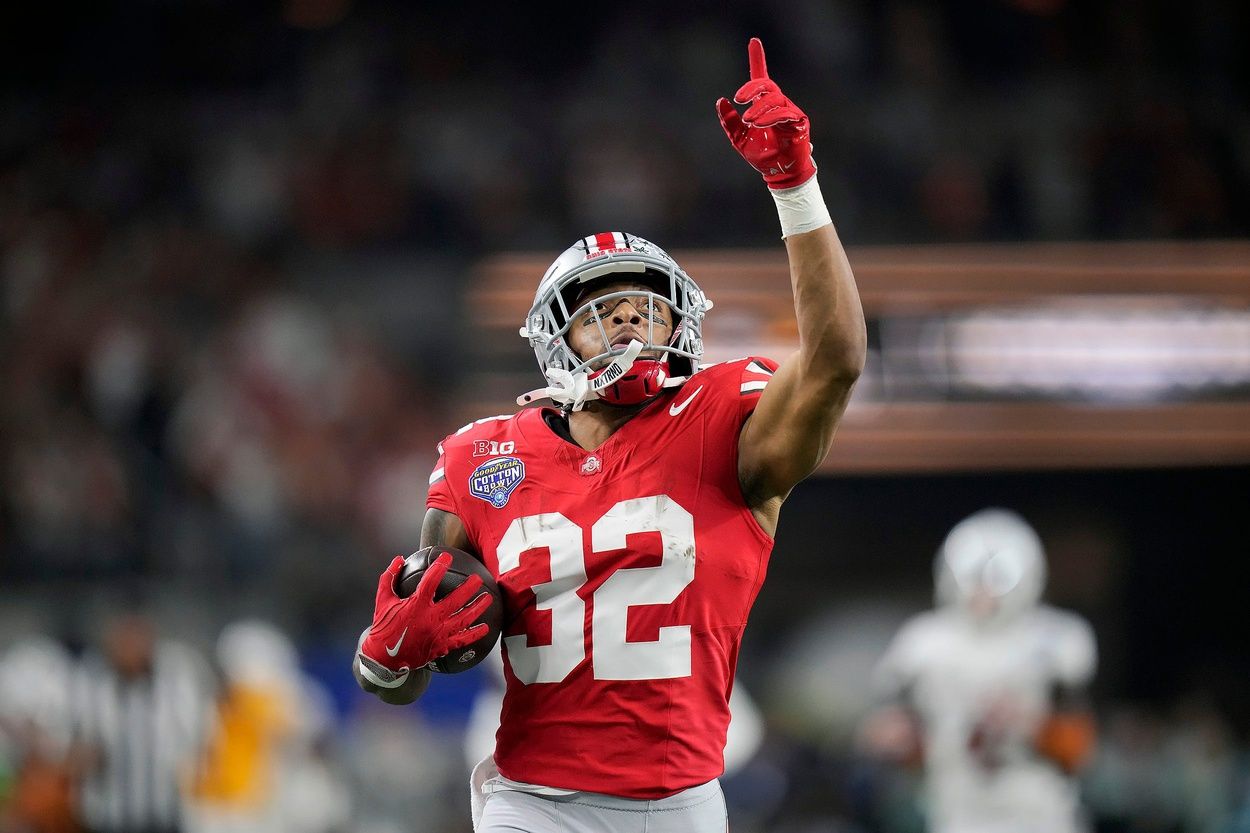 Ohio State Buckeyes running back TreVeyon Henderson (32) scores a touchdown on a 75-yard touchdown catch and run against Texas Longhorns in the second quarter of the Cotton Bowl Classic during the College Football Playoff semifinal game at AT&T Stadium in Arlington, Texas on January, 10, 2025.