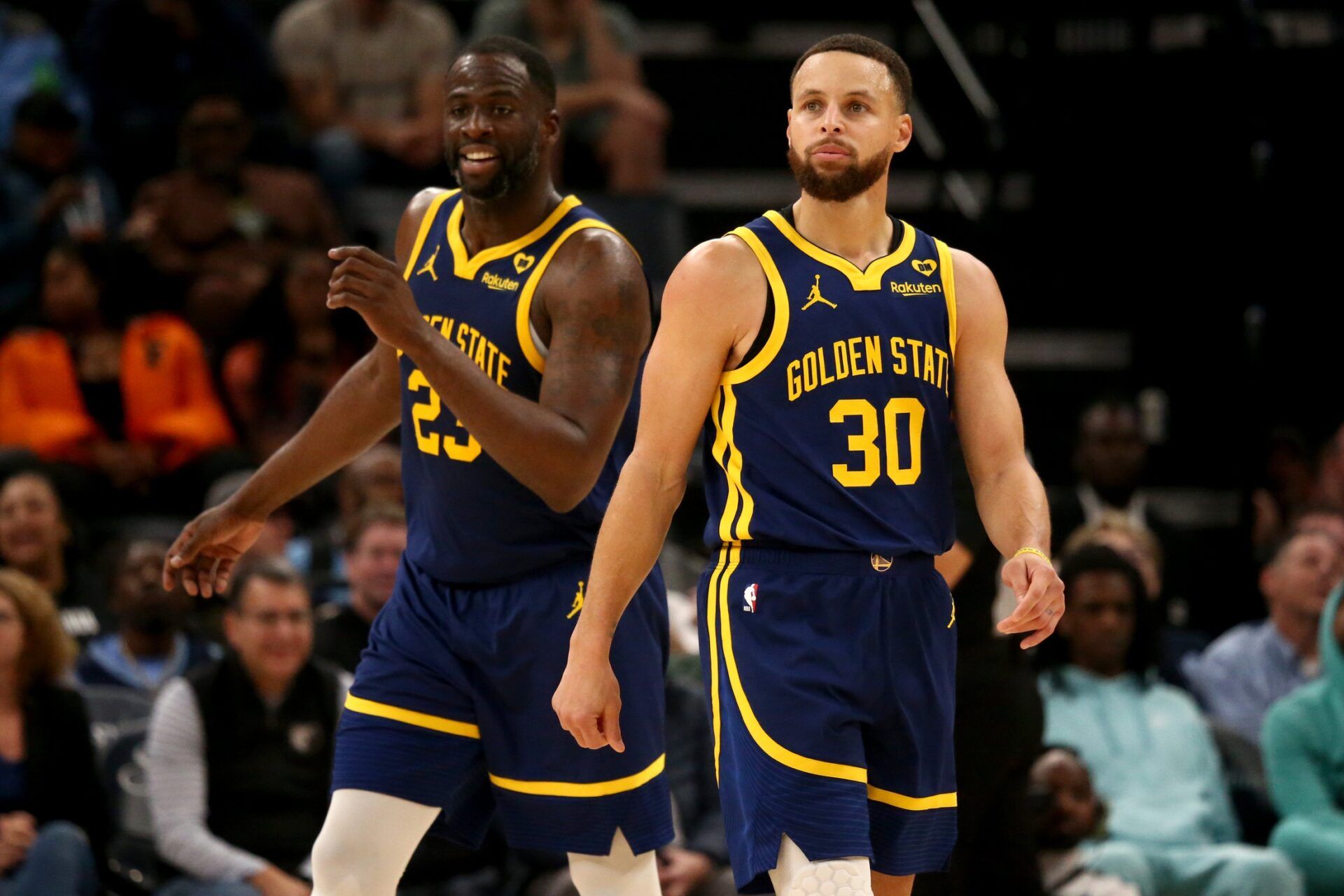 Golden State Warriors forward Draymond Green (23) and guard Stephen Curry (30) react during the second half against the Memphis Grizzlies at FedExForum.