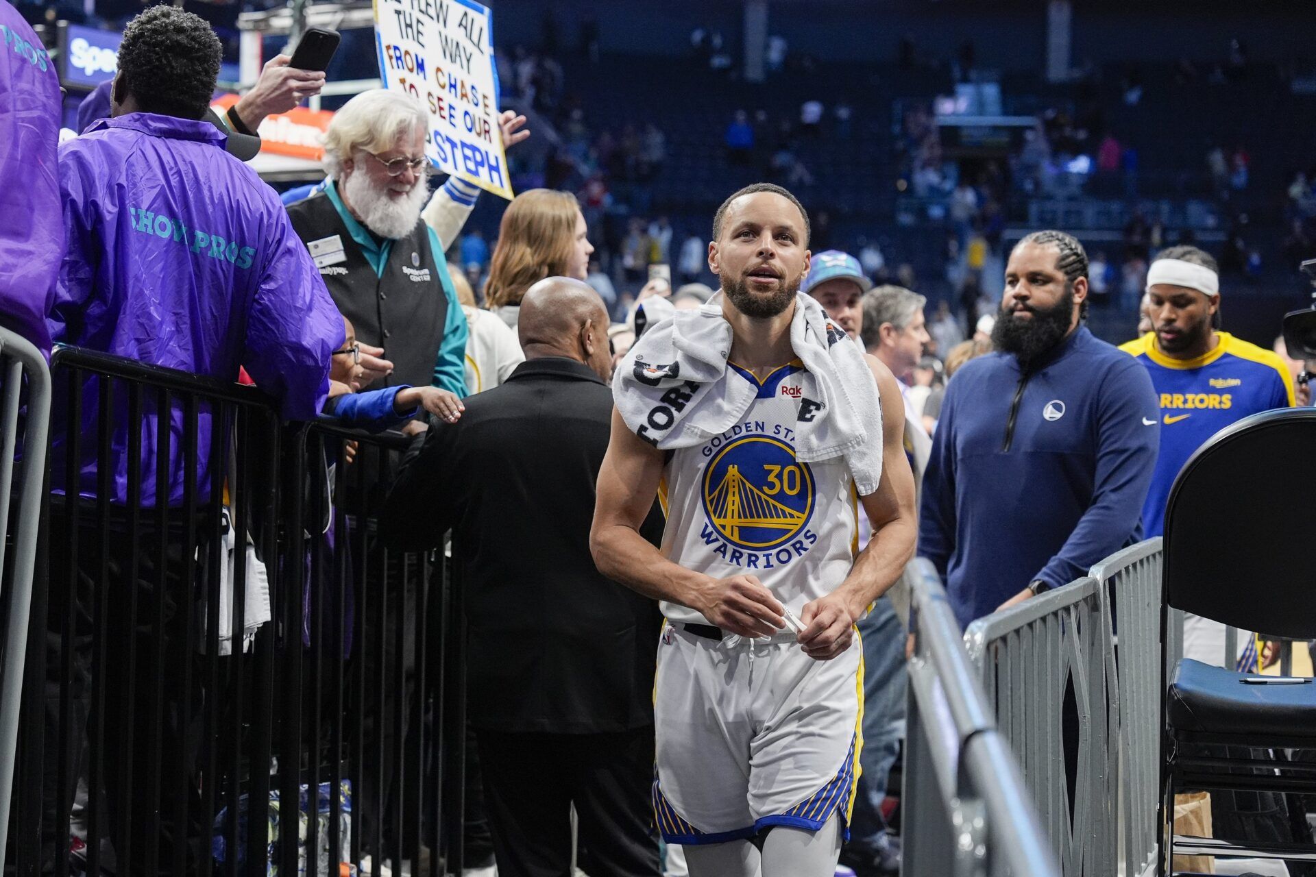 Golden State Warriors guard Stephen Curry (30) reacts to his home town fans as he makes his way to the locker rooom after the second half against the Charlotte Hornets at Spectrum Center.