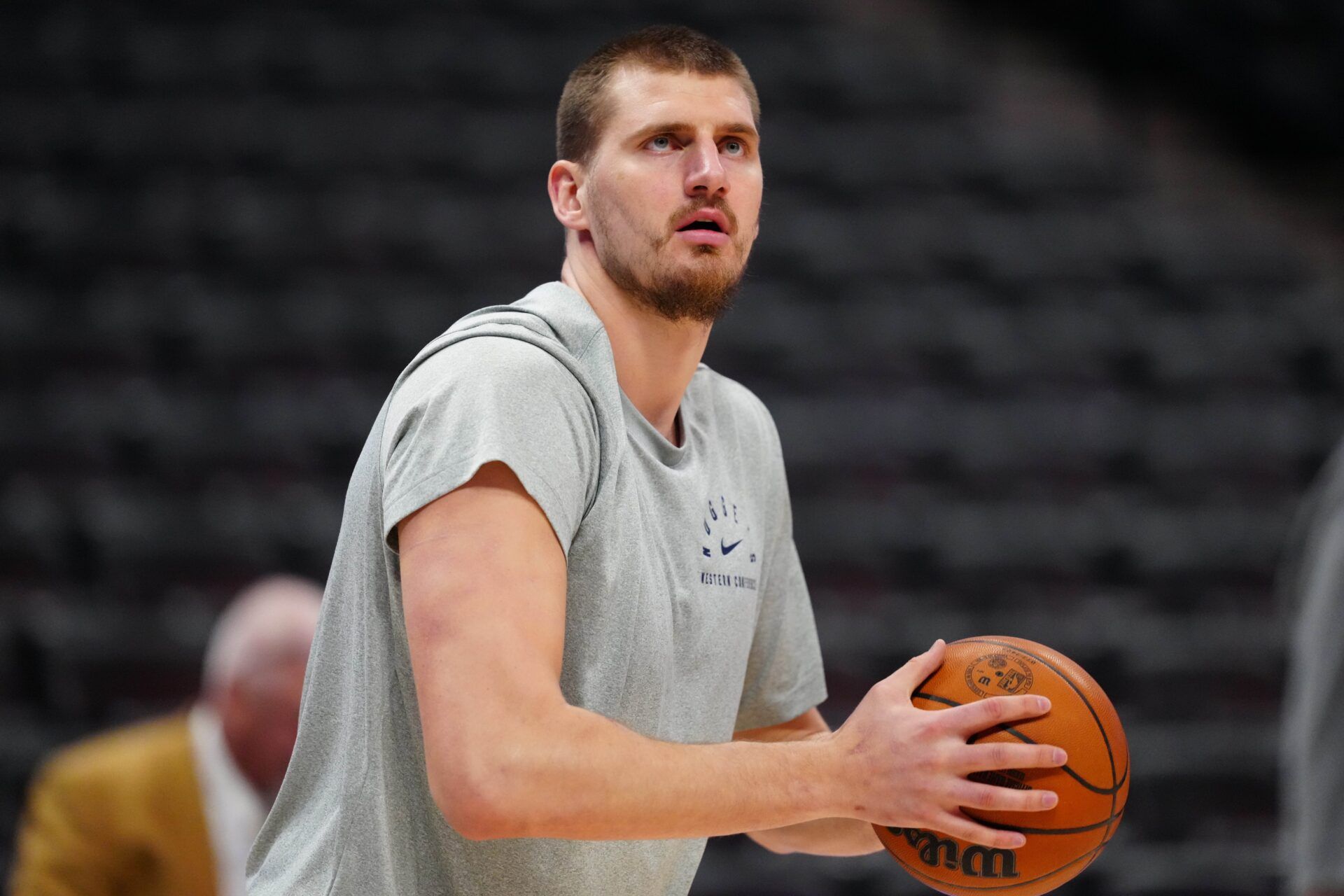 Denver Nuggets center Nikola Jokic (15) warms up before a game against the Orlando Magic at Ball Arena.