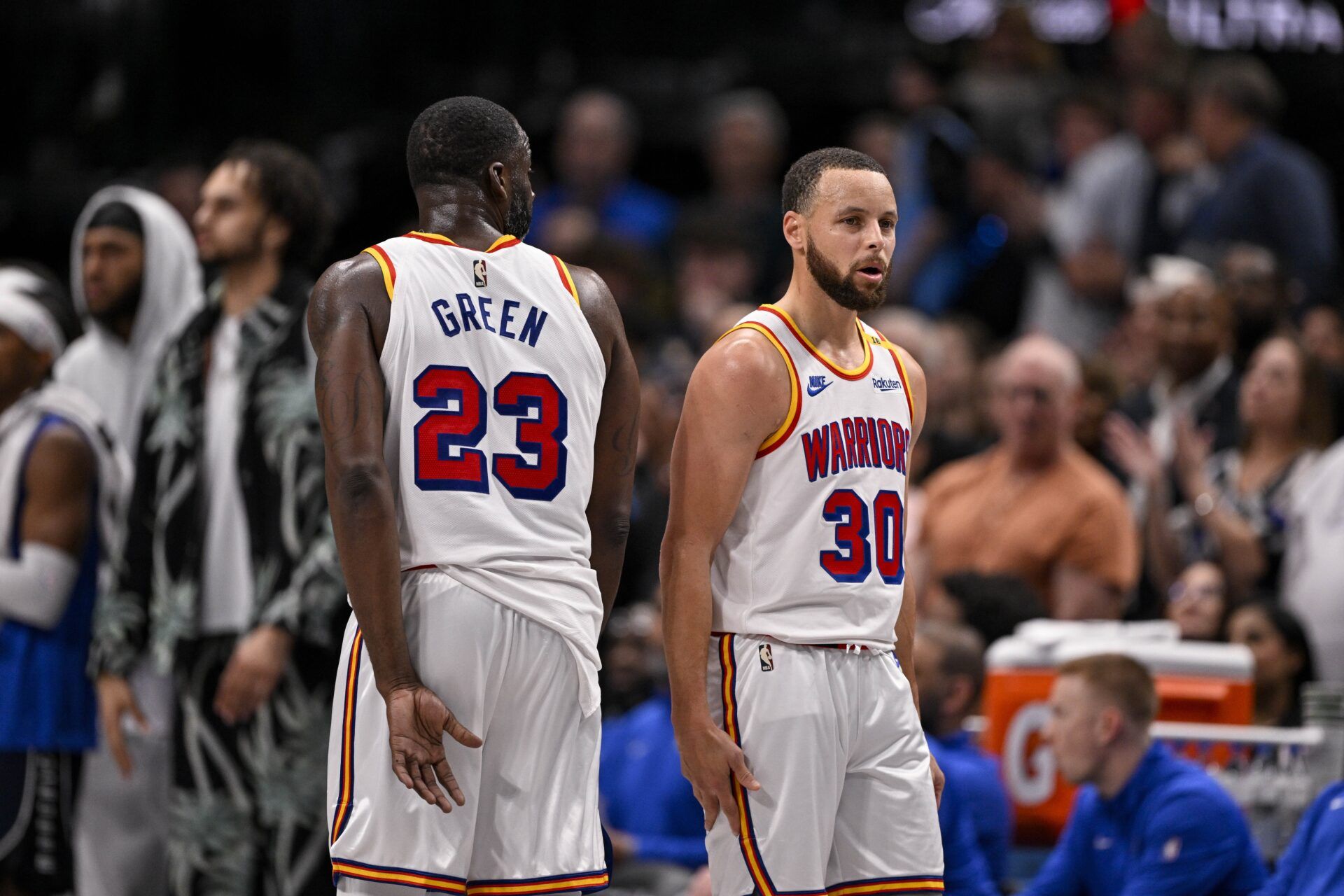 Golden State Warriors forward Draymond Green (23) and guard Stephen Curry (30) during the game between the Dallas Mavericks and the Golden State Warriors at the American Airlines Center.