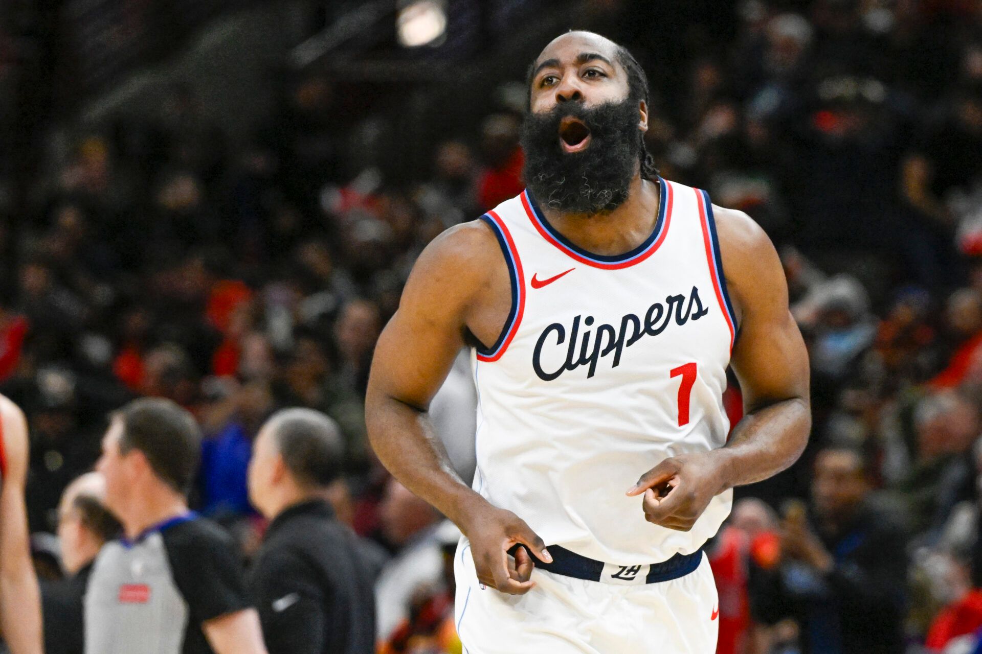 Feb 26, 2025; Chicago, Illinois, USA; LA Clippers guard James Harden (1) looks towards former Chicago Bulls player Pat Beverley, who was on the sidelines, after scoring against the Chicago Bulls during the second half at the United Center. Mandatory Credit: Matt Marton-Imagn Images