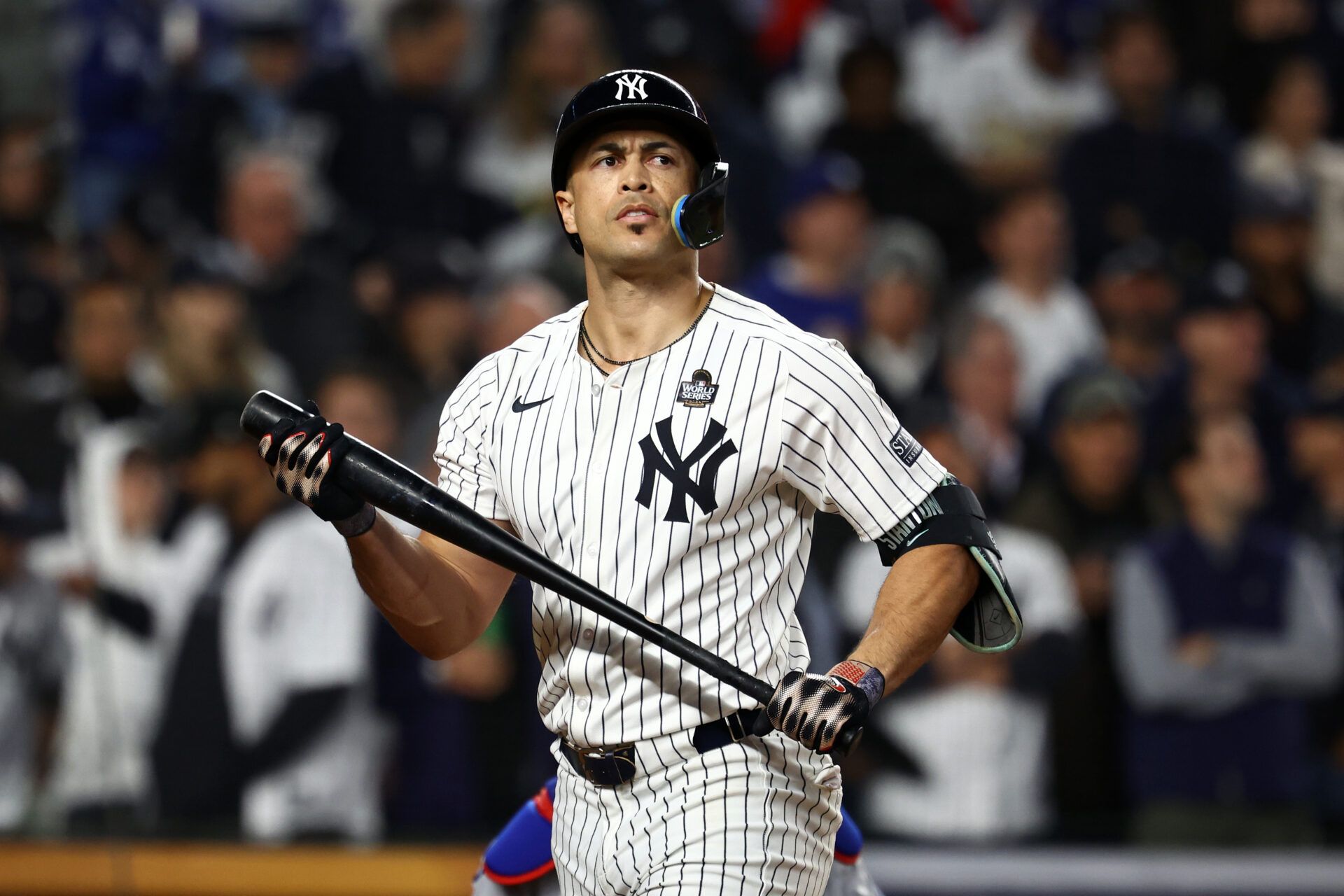 New York Yankees designated hitter Giancarlo Stanton (27) reacts after striking out against the Los Angeles Dodgers in the fifth inning during game four of the 2024 MLB World Series at Yankee Stadium.