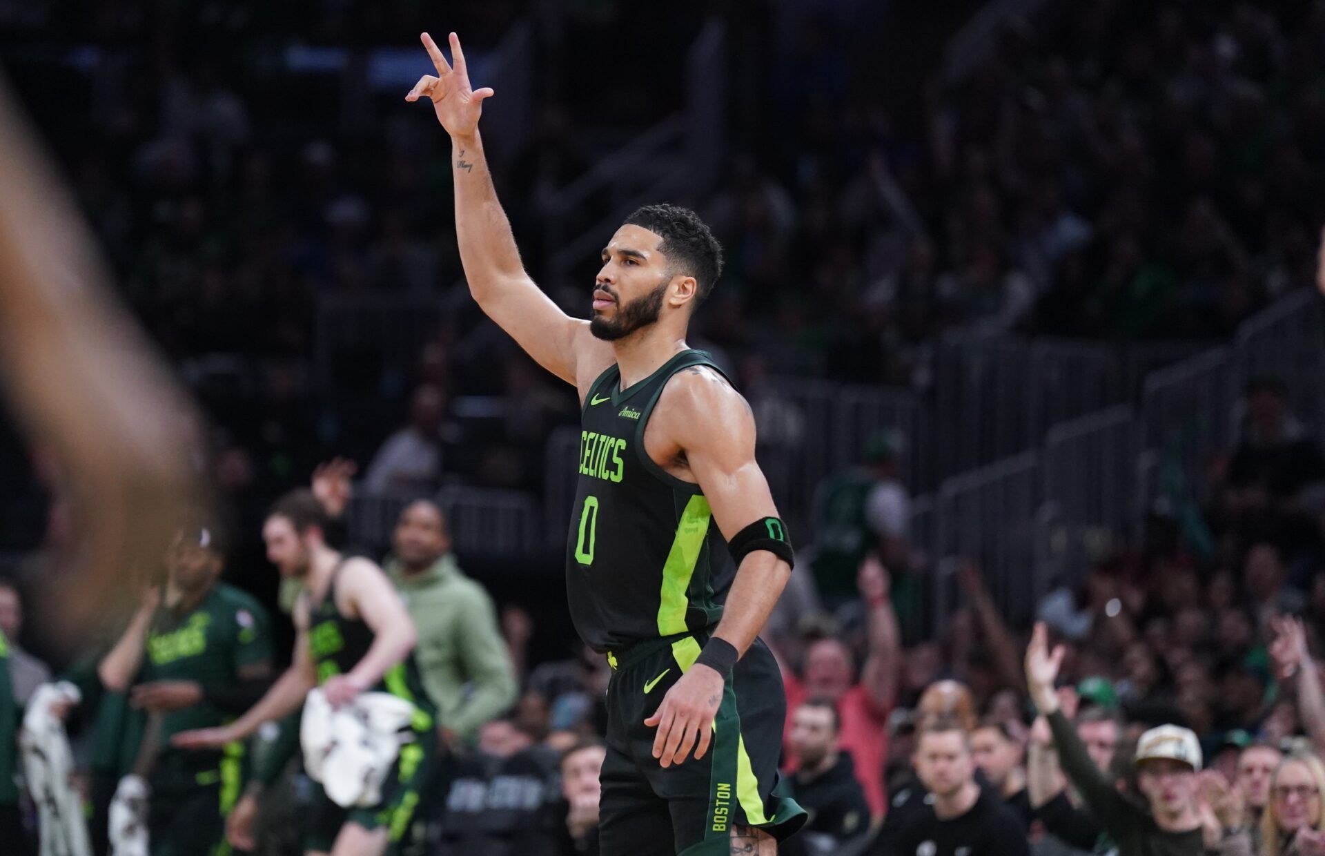 Boston Celtics forward Jayson Tatum (0) reacts after his three point basket against the Philadelphia 76ers in the second half at TD Garden.