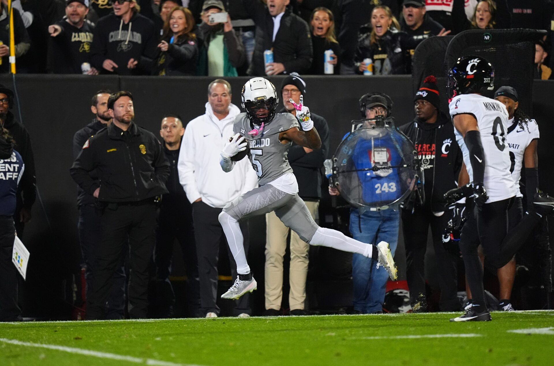 Colorado Buffaloes wide receiver Jimmy Horn Jr. (5) signals a peace sign to Cincinnati Bearcats defensive back Josh Minkins (0) and is called for taunting penalty in the first quarter at Folsom Field.