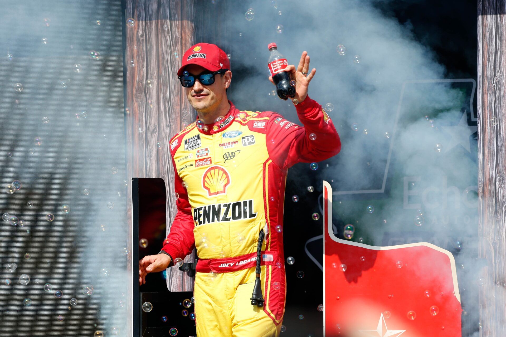 NASCAR Cup Series driver Joey Logano (22) walks out onto the stage for driver introductions before the EchoPark Automotive Grand Prix at Circuit of the Americas.