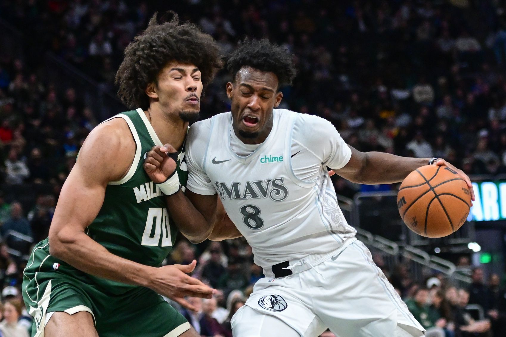 Dallas Mavericks forward Olivier-Maxence Prosper (8) drives for the basket against Milwaukee Bucks center Jericho Sims (00) in the third quarter at Fiserv Forum.