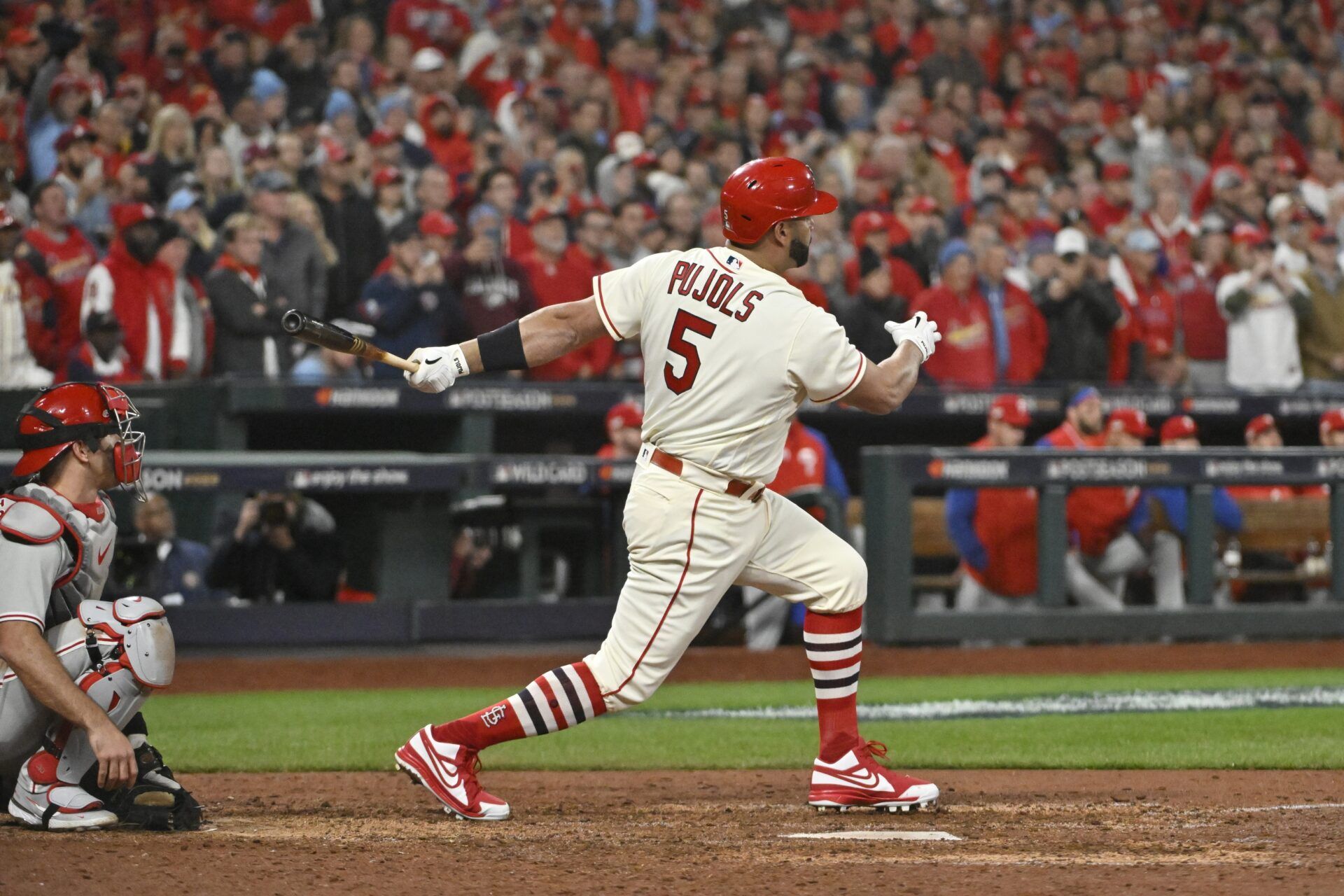 St. Louis Cardinals designated hitter Albert Pujols (5) hits a single in the eighth inning against the Philadelphia Phillies during game two of the Wild Card series for the 2022 MLB Playoffs at Busch Stadium. Mandatory Credit: