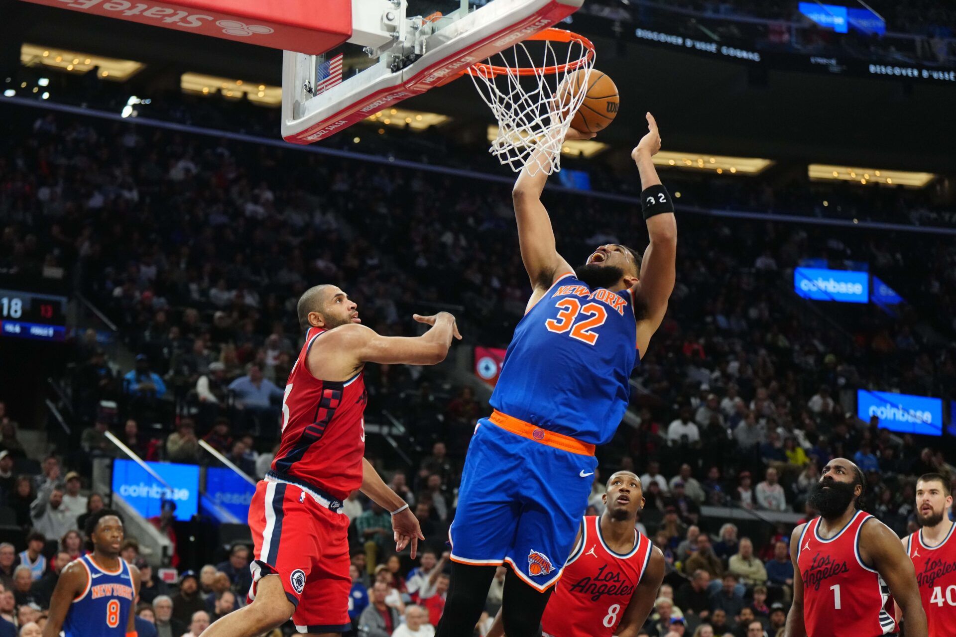 New York Knicks center Karl-Anthony Towns (32) shoots the ball against LA Clippers forward Nicolas Batum (33) in the second half at Intuit Dome.