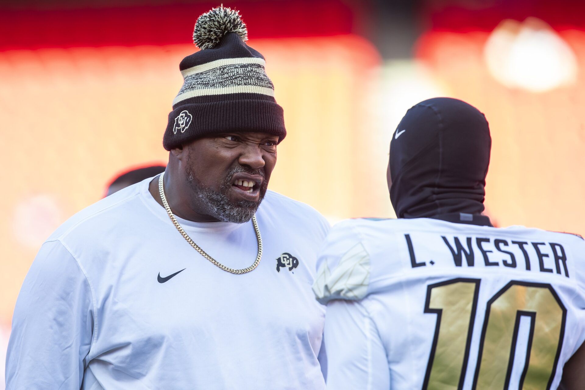 Colorado coach Warren Sapp motivates Colorado wide receiver LaJohntay Wester (10) prior to the game between the Kansas Jayhawks and the Colorado Buffaloes at GEHA Field at Arrowhead Stadium.