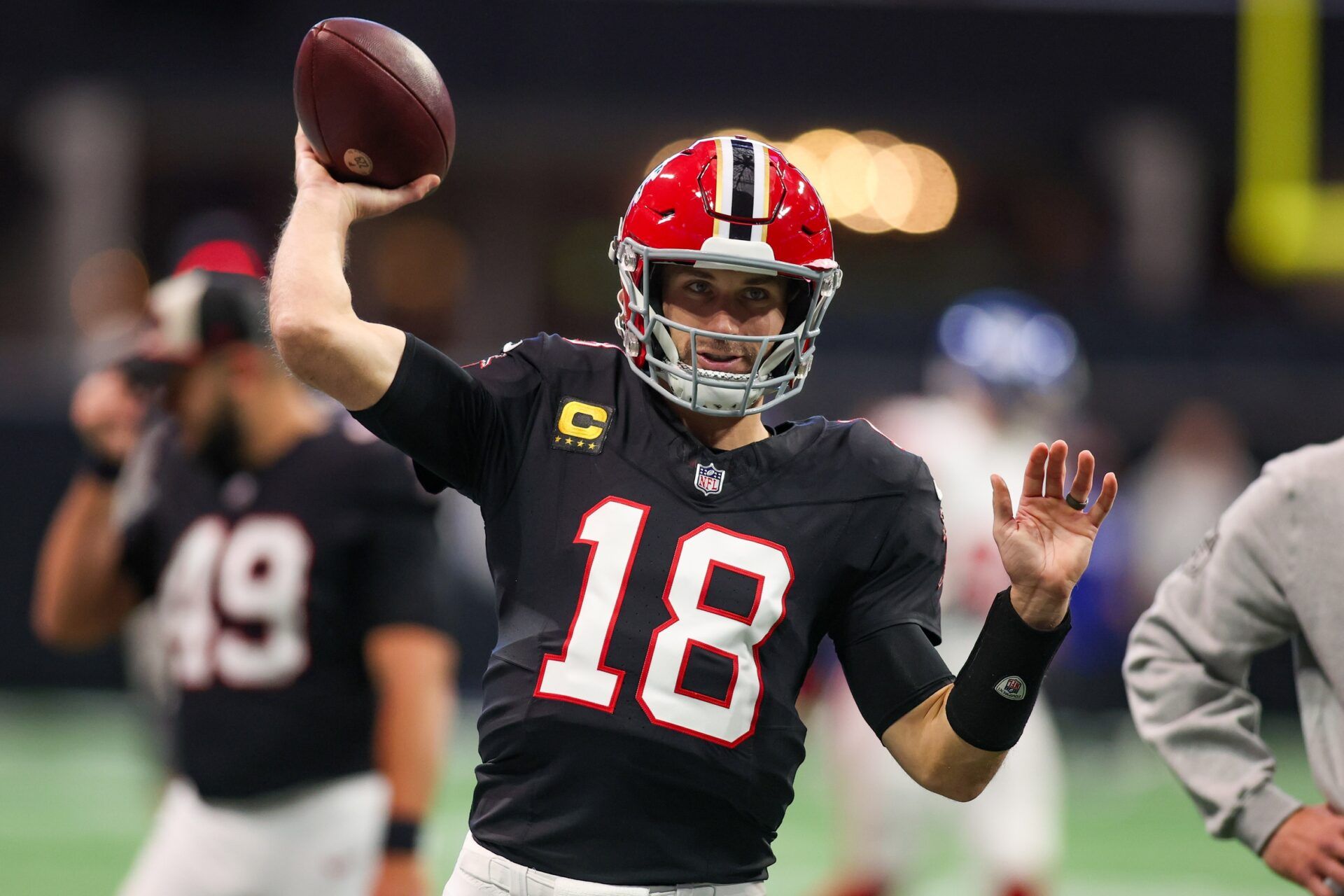 Atlanta Falcons quarterback Kirk Cousins (18) prepares for a game against the New York Giants at Mercedes-Benz Stadium.