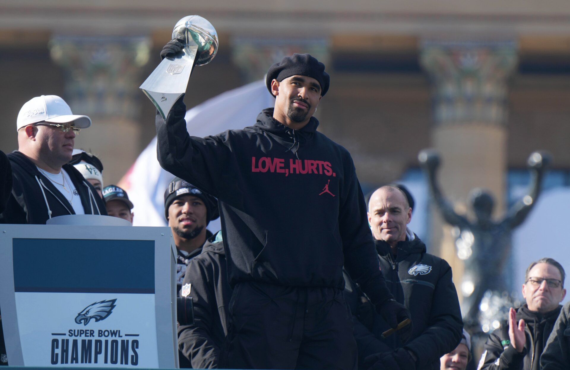 Philadelphia Eagles quarterback Jalen Hurts holds the Vince Lombardi Trophy during the Super Bowl LIX championship parade and rally.