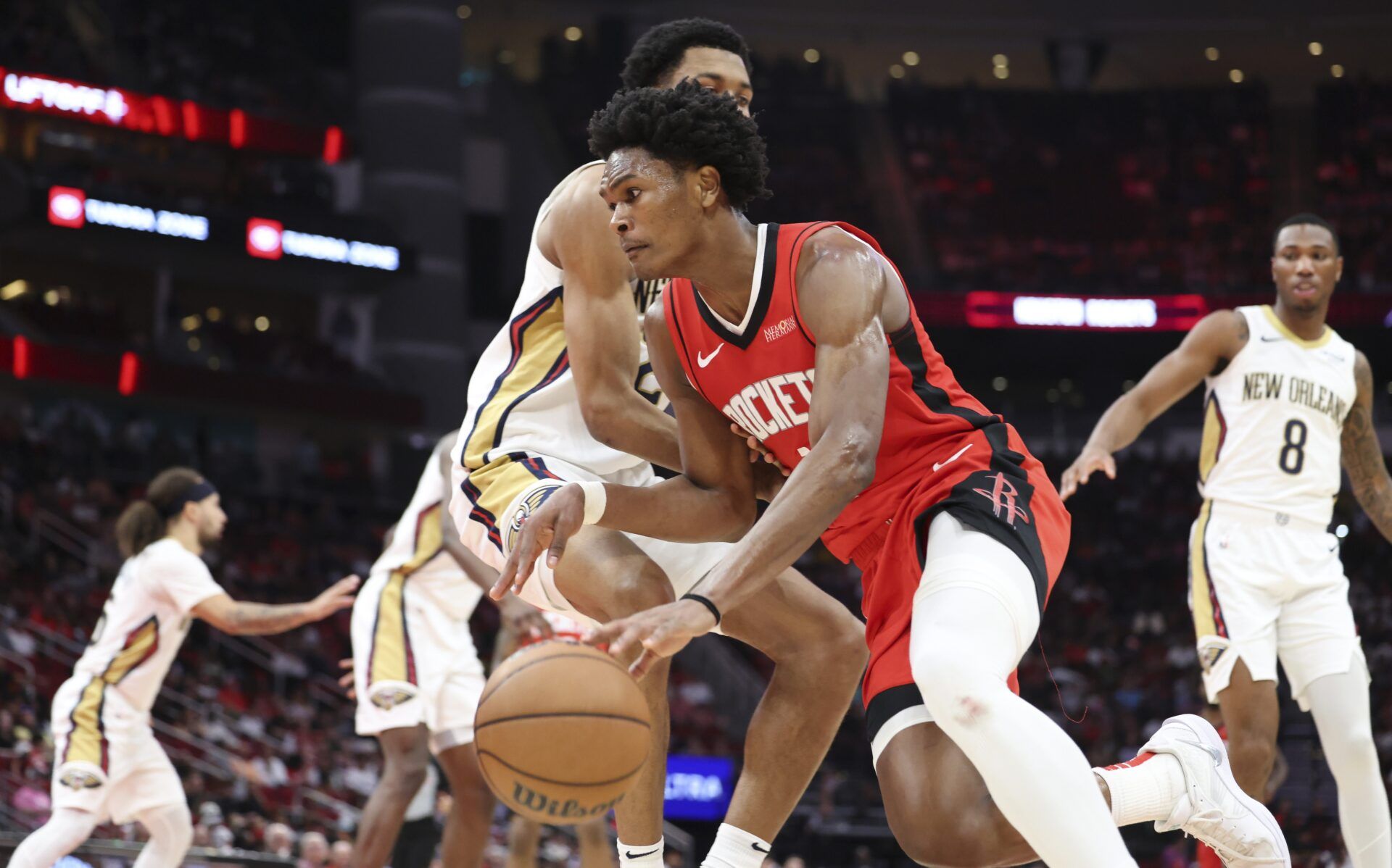 Houston Rockets forward Amen Thompson (1) dribbles the ball during the game against the New Orleans Pelicans at Toyota Center.